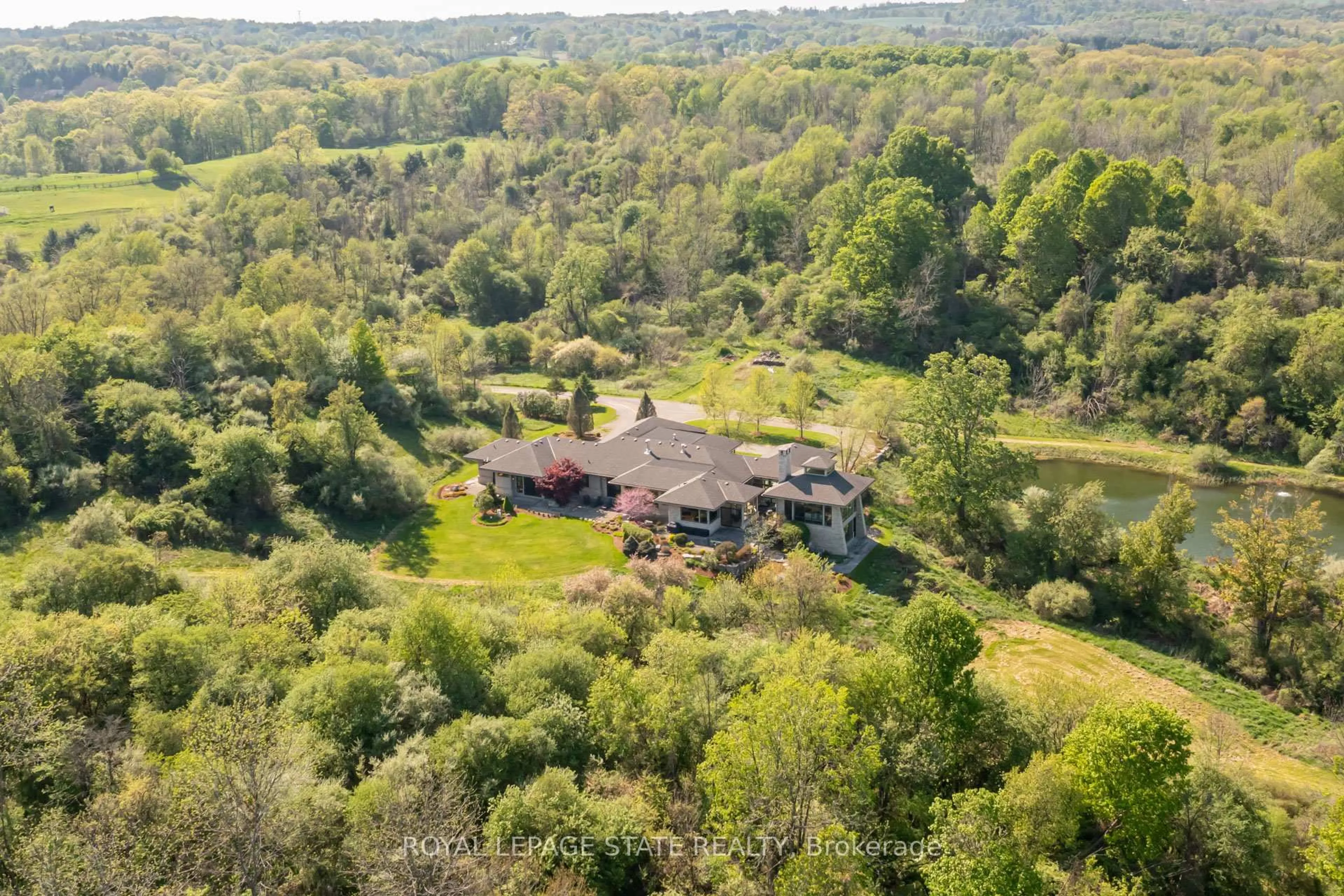 A pic from outside/outdoor area/front of a property/back of a property/a pic from drone, forest/trees view for 1099 Mineral Springs Rd, Hamilton Ontario L9H 5E3