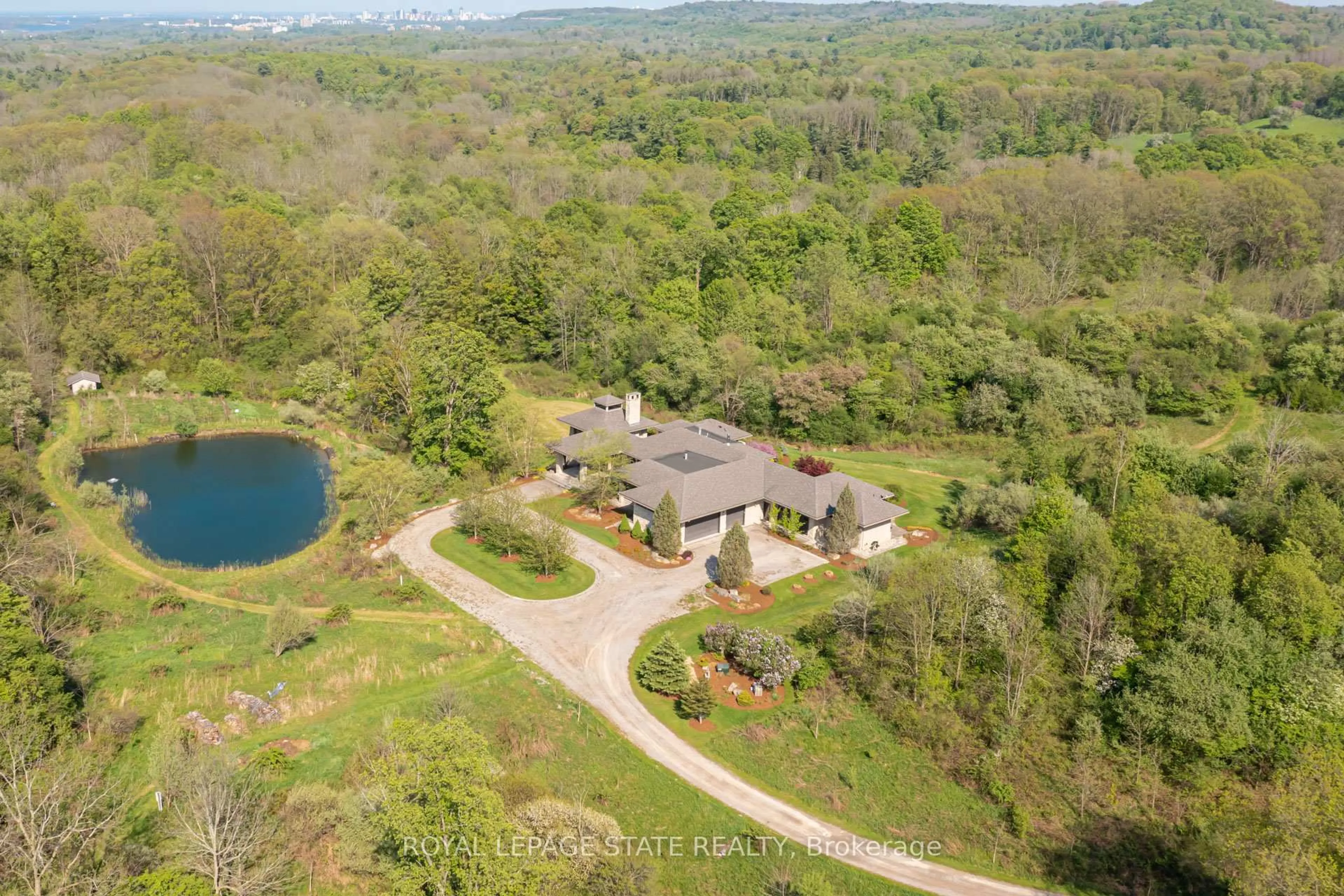 A pic from outside/outdoor area/front of a property/back of a property/a pic from drone, water/lake/river/ocean view for 1099 Mineral Springs Rd, Hamilton Ontario L9H 5E3