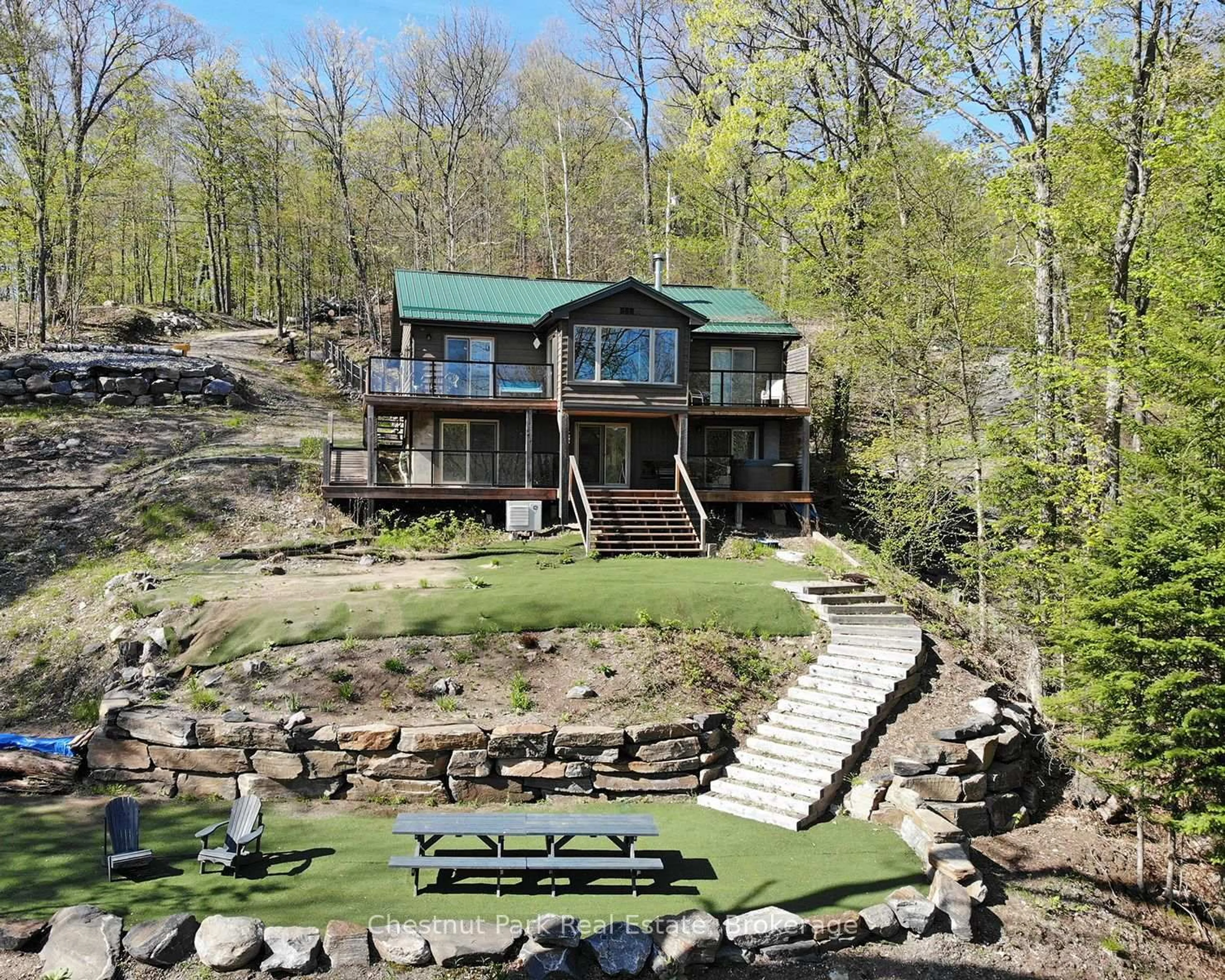 A pic from outside/outdoor area/front of a property/back of a property/a pic from drone, water/lake/river/ocean view for 1027 Select Tr, Dysart et al Ontario K0M 1S0