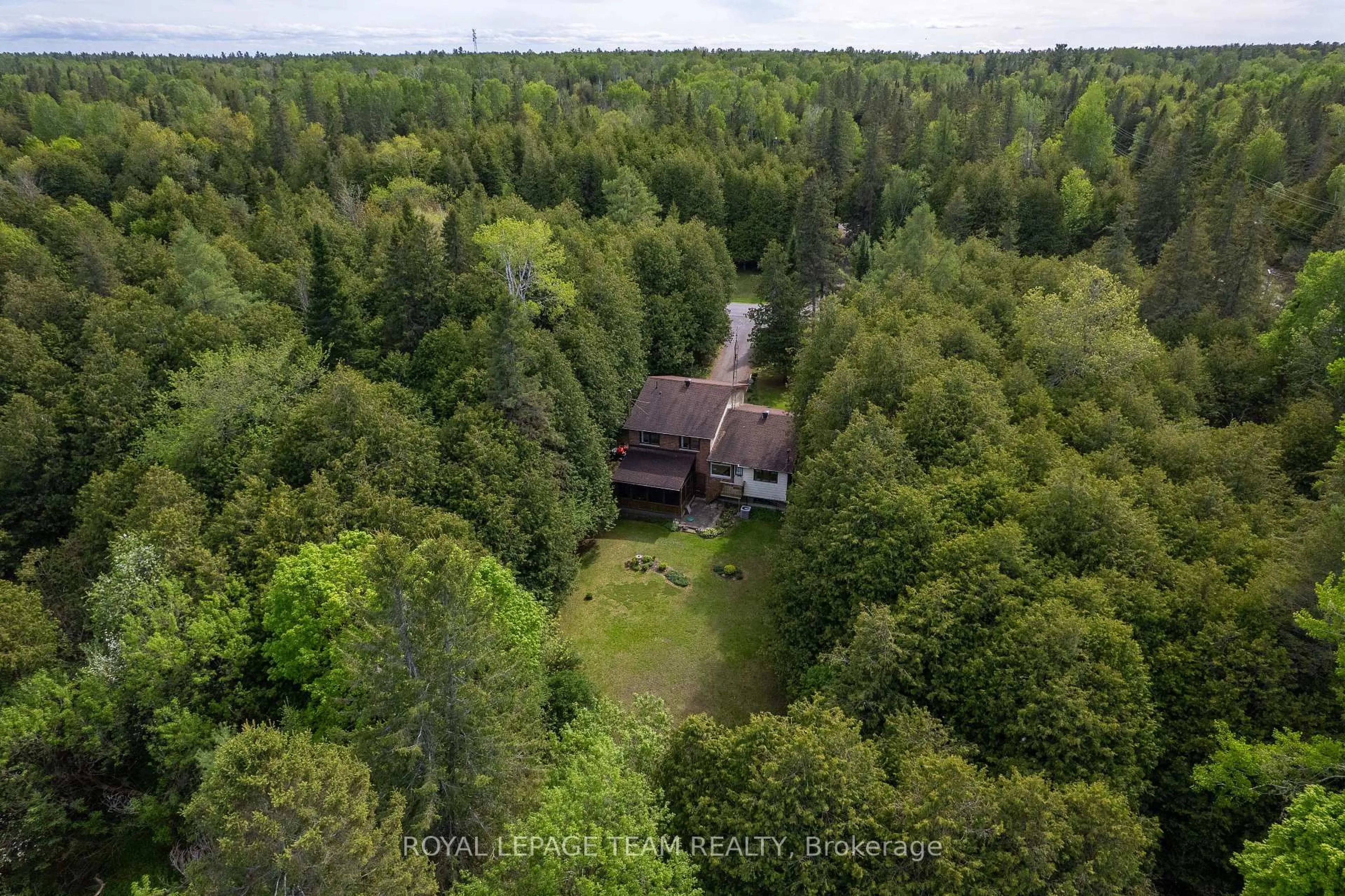 A pic from outside/outdoor area/front of a property/back of a property/a pic from drone, forest/trees view for 116 Deerwood Dr, Kinburn Ontario K0A 2H0