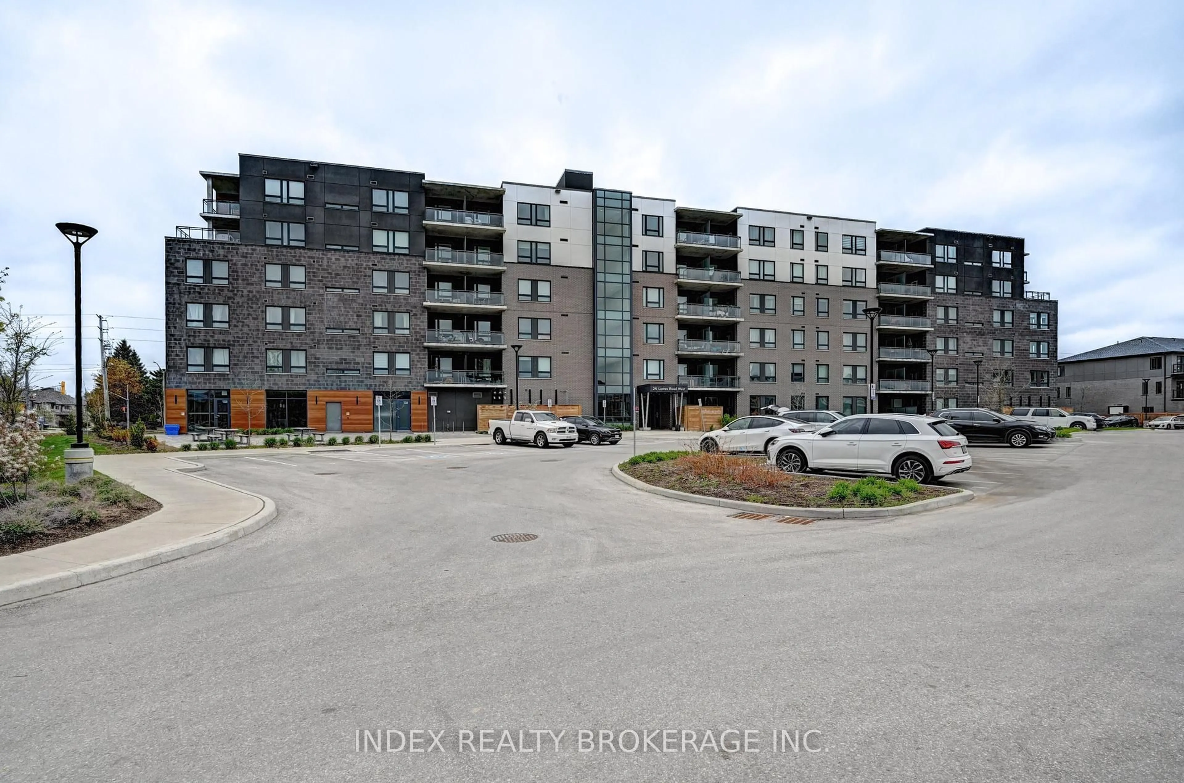 A pic from outside/outdoor area/front of a property/back of a property/a pic from drone, unknown for 26 Lowes St #108, Guelph Ontario N1G 0H4