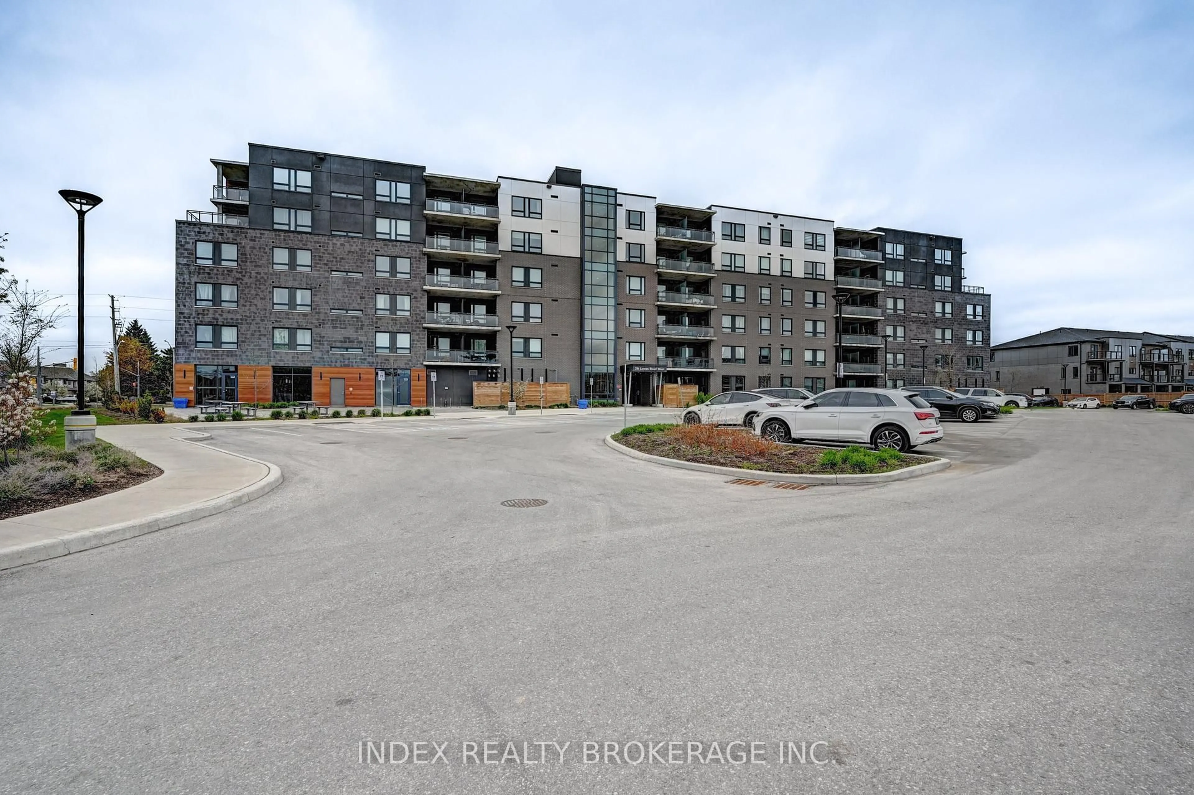 A pic from outside/outdoor area/front of a property/back of a property/a pic from drone, unknown for 26 Lowes St #108, Guelph Ontario N1G 0H4