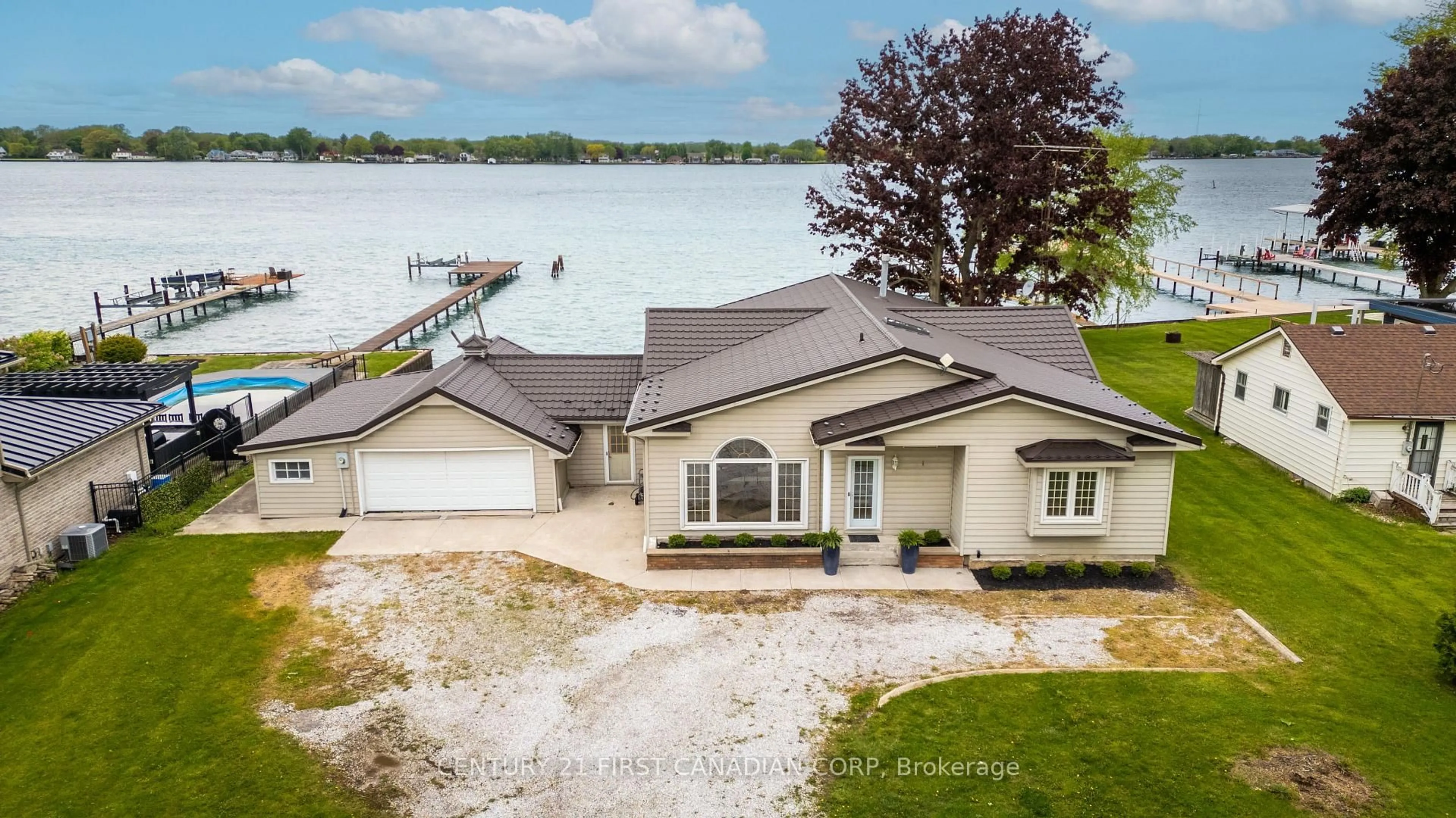 A pic from outside/outdoor area/front of a property/back of a property/a pic from drone, water/lake/river/ocean view for 3877 St Clair Pkwy, St. Clair Ontario N0P 2B0