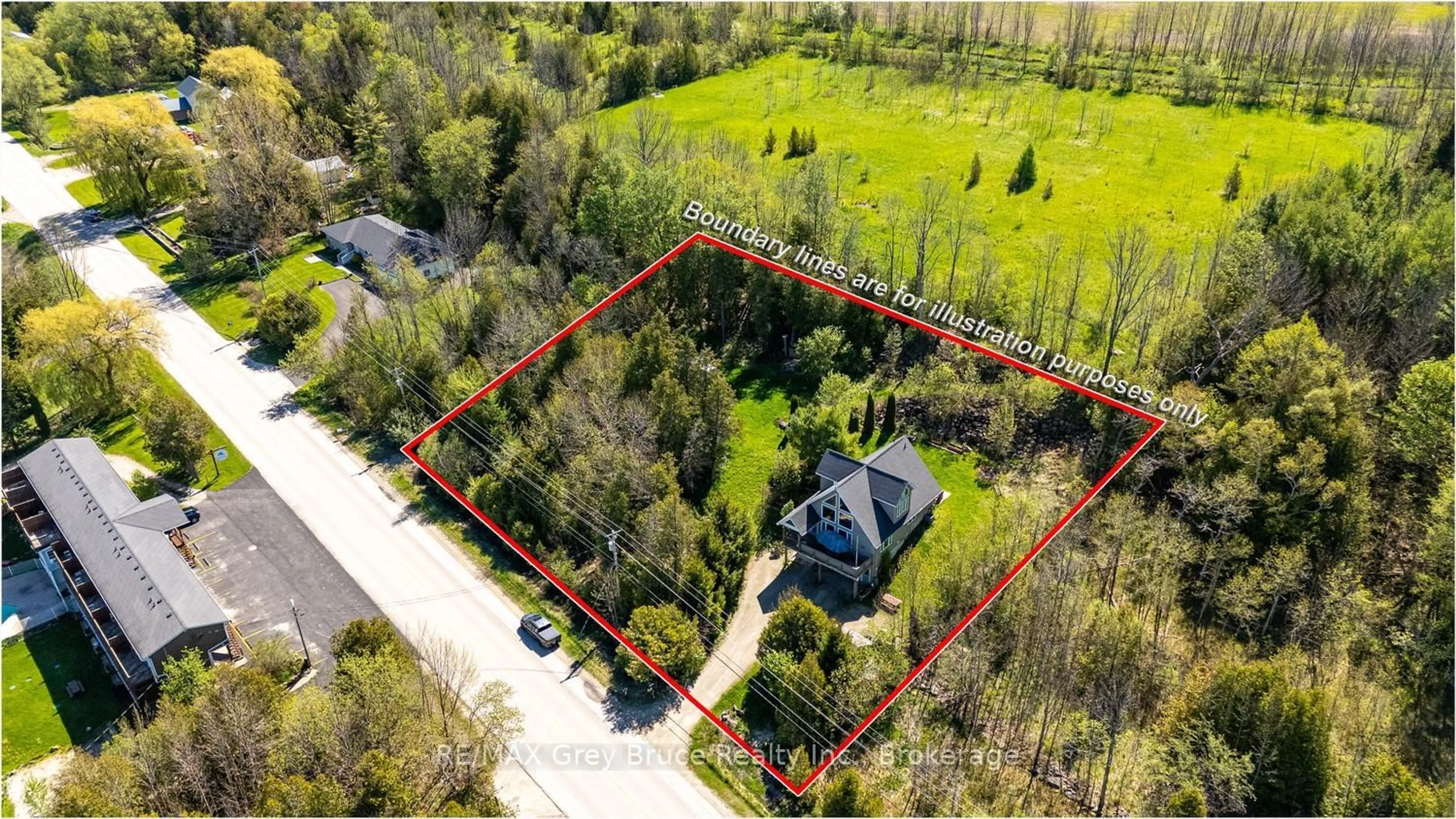 A pic from outside/outdoor area/front of a property/back of a property/a pic from drone, street for 501192 Grey 1 Rd, Georgian Bluffs Ontario N0H 2T0