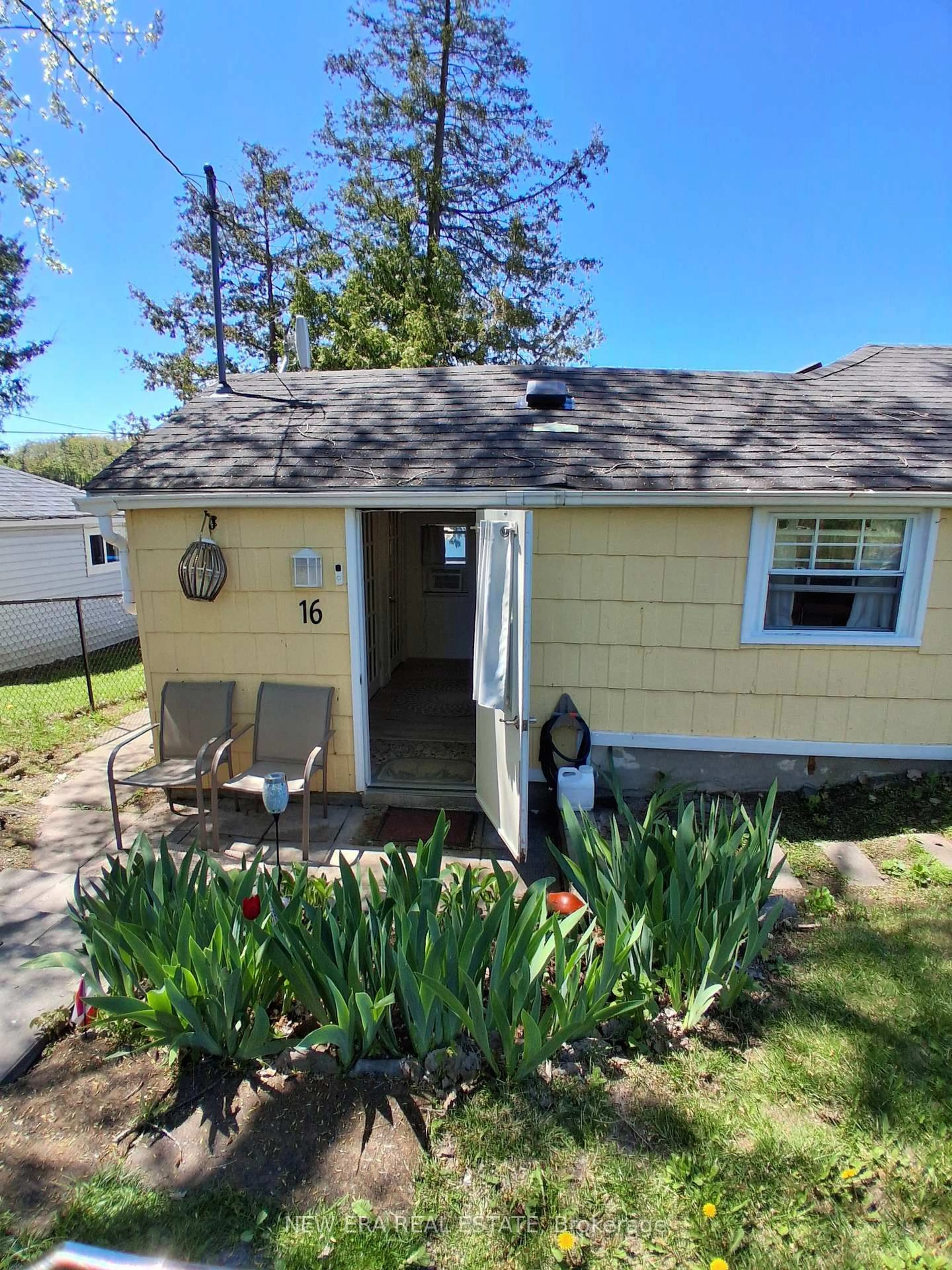 Home with vinyl exterior material, street for 16 Pines Lane, Stirling Ontario K0K 3E0