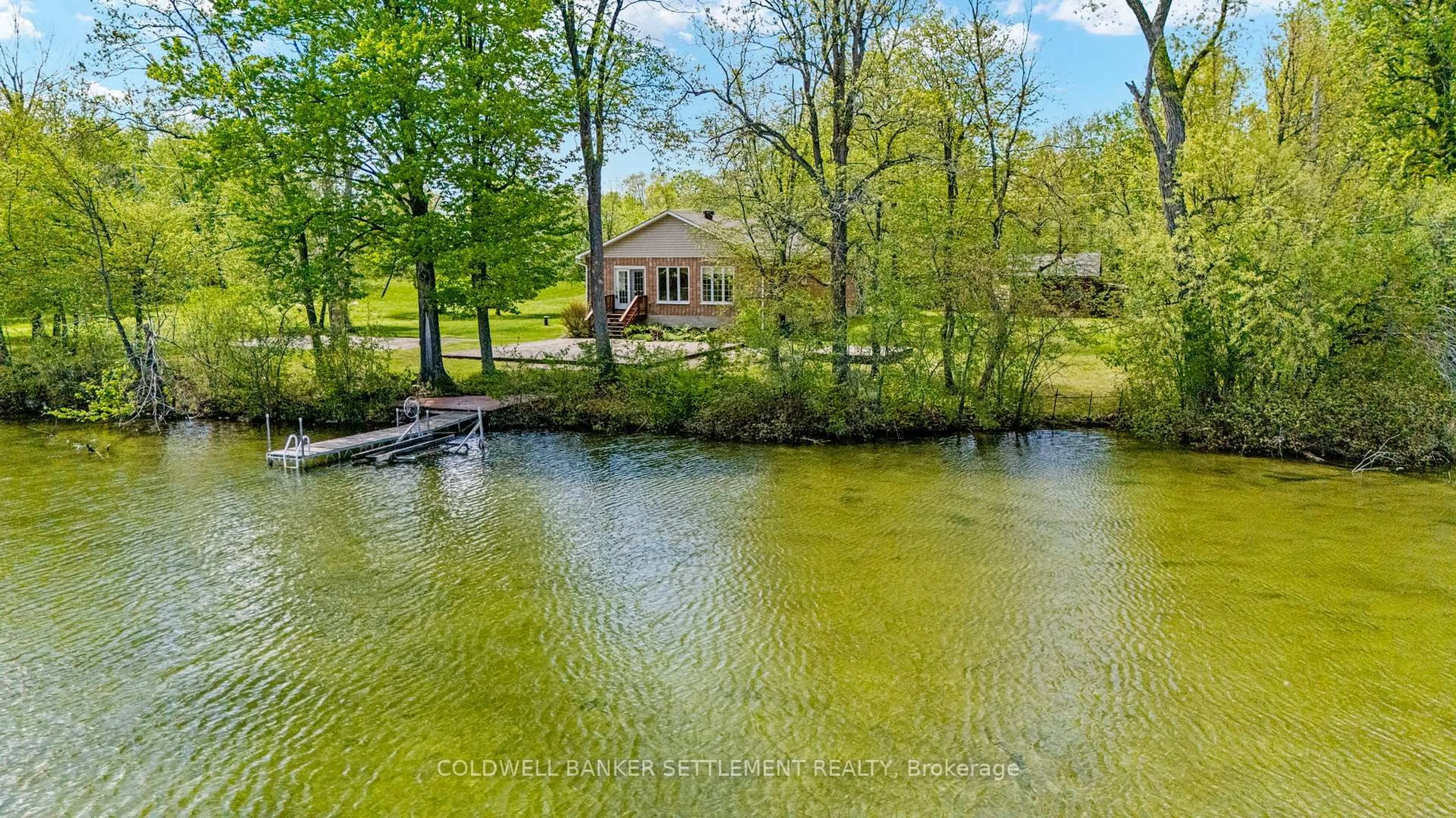 A pic from outside/outdoor area/front of a property/back of a property/a pic from drone, water/lake/river/ocean view for 52 Berry Park Lane, Rideau Lakes Ontario K0G 1L0