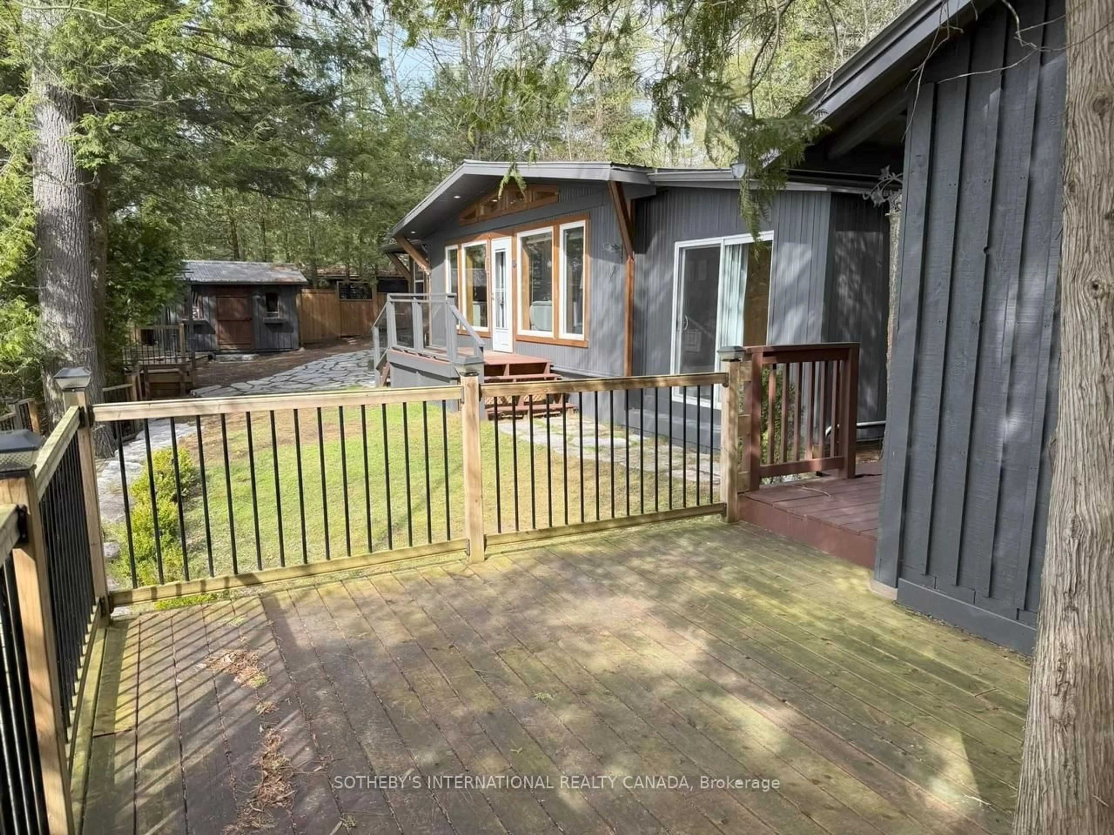 A pic from outside/outdoor area/front of a property/back of a property/a pic from drone, forest/trees view for 1030 Cobble Rose Lane, Minden Hills Ontario K0M 2L1