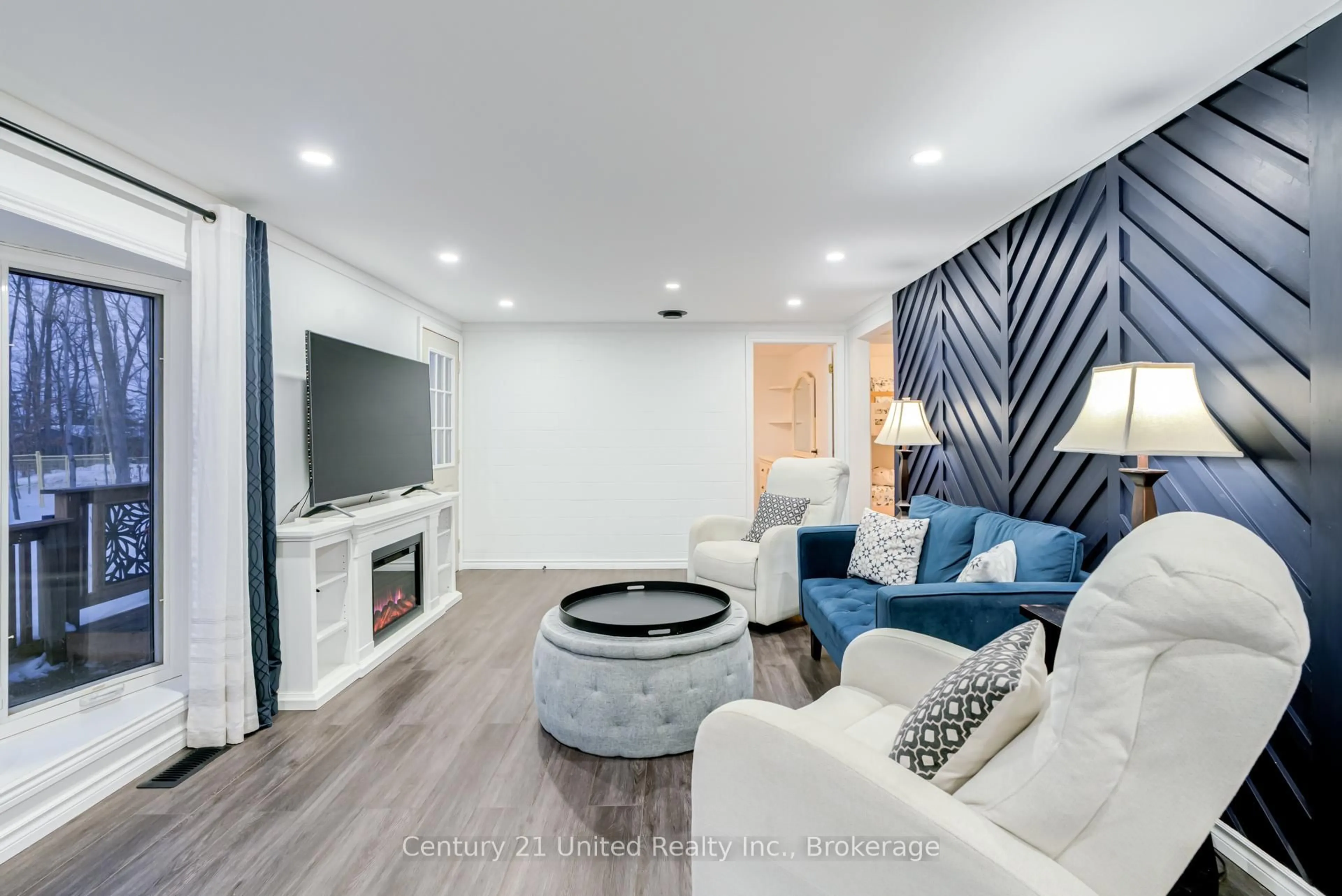 Living room with furniture, wood/laminate floor for 32 Teds Lane, Trent Lakes Ontario K0L 1K0