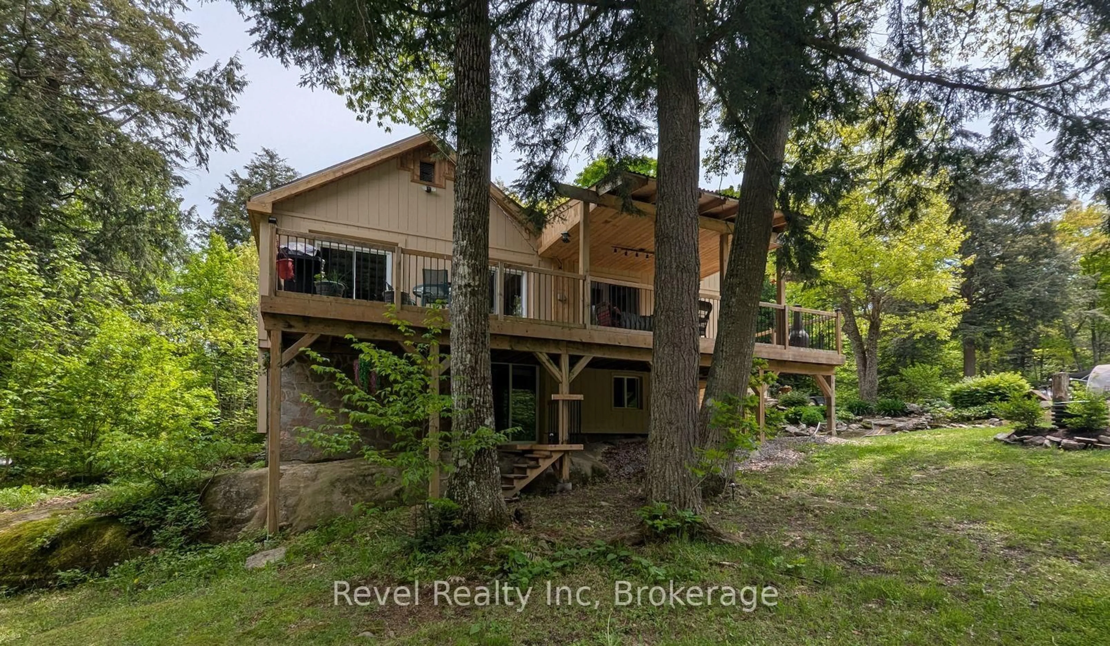 A pic from outside/outdoor area/front of a property/back of a property/a pic from drone, forest/trees view for 22 Camp Rd, McKellar Ontario P2A 0B4