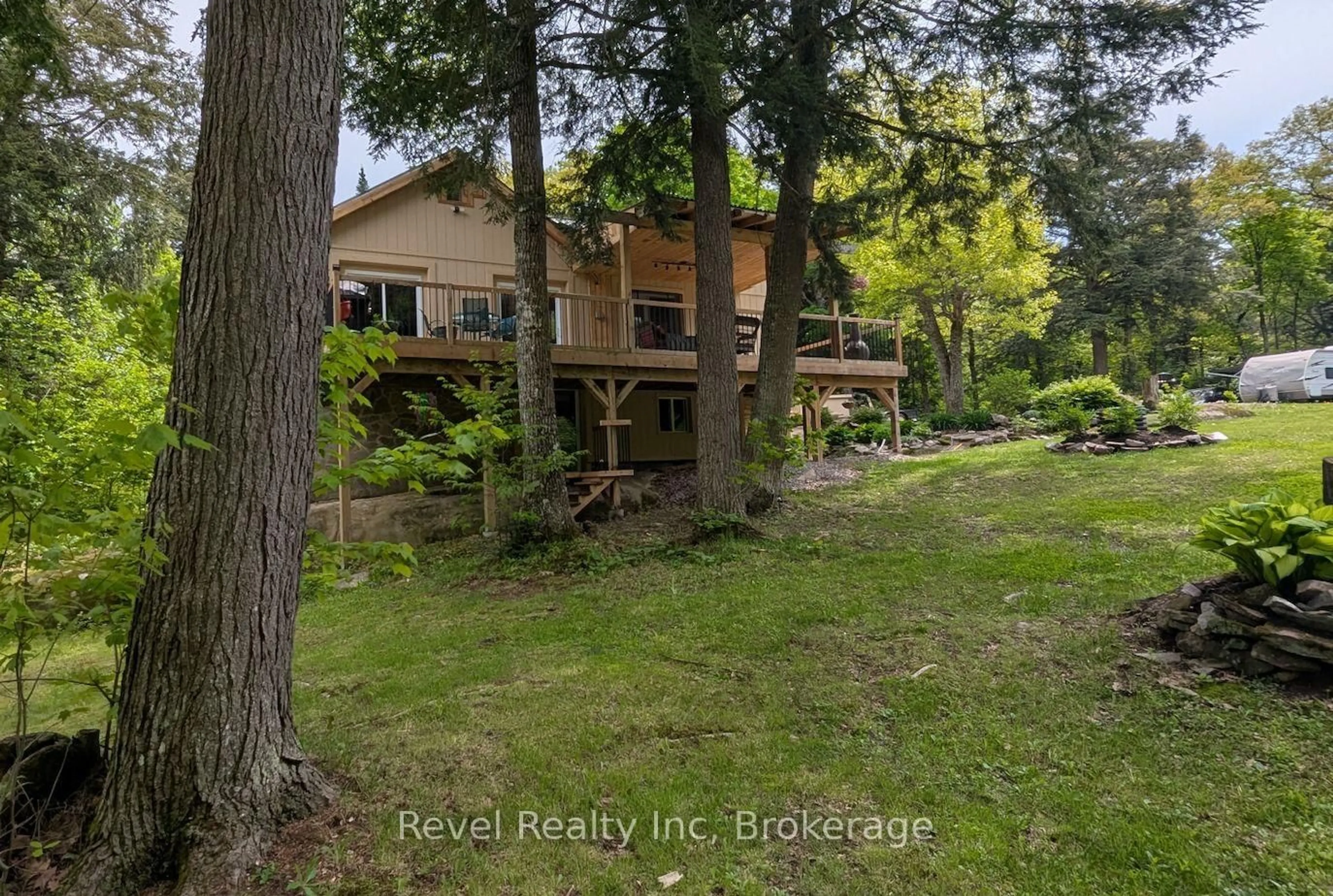 A pic from outside/outdoor area/front of a property/back of a property/a pic from drone, forest/trees view for 22 Camp Rd, McKellar Ontario P2A 0B4