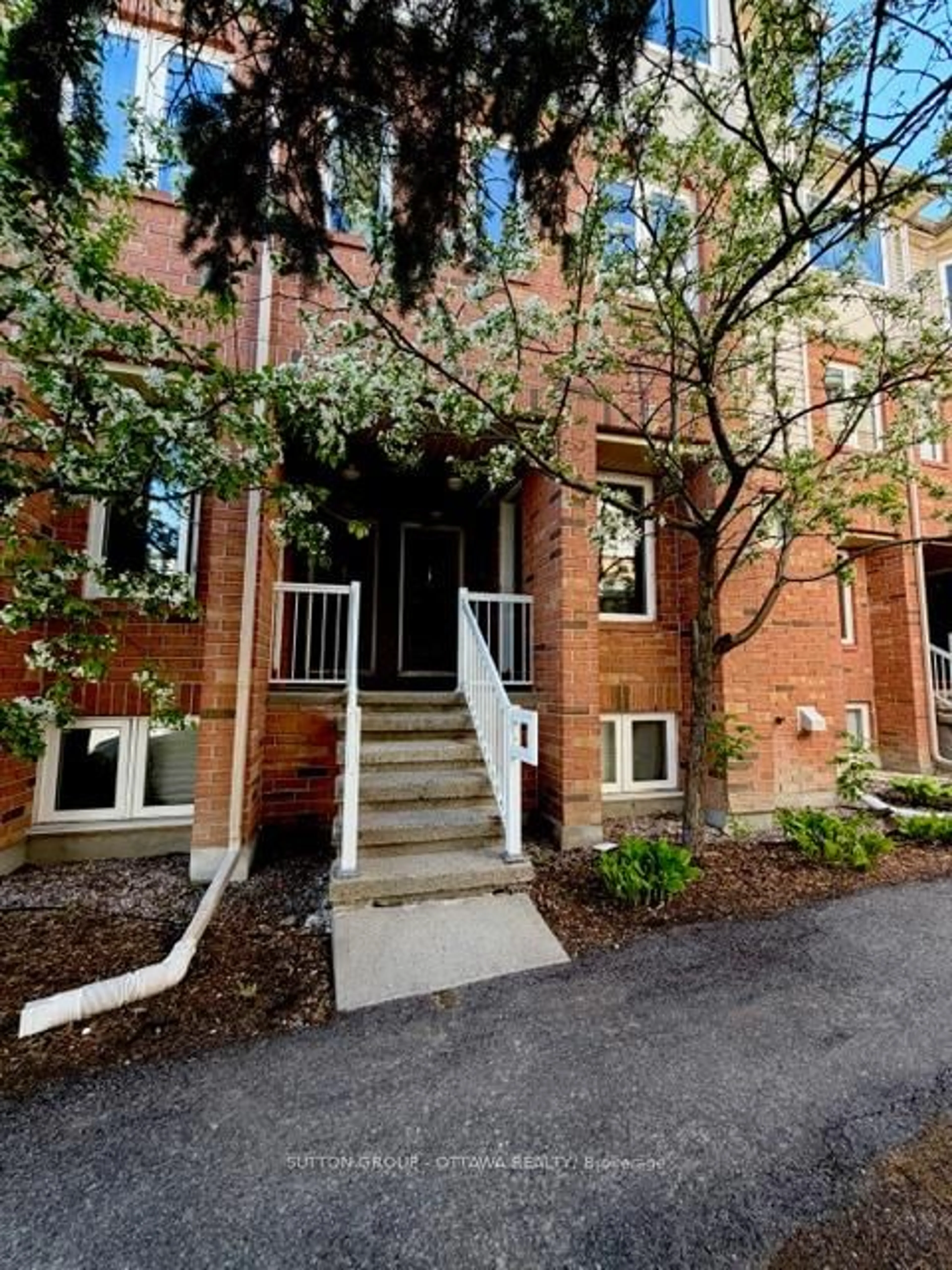 Home with brick exterior material, street for 115 Tall Pines Private, Ottawa Ontario K2H 1H1