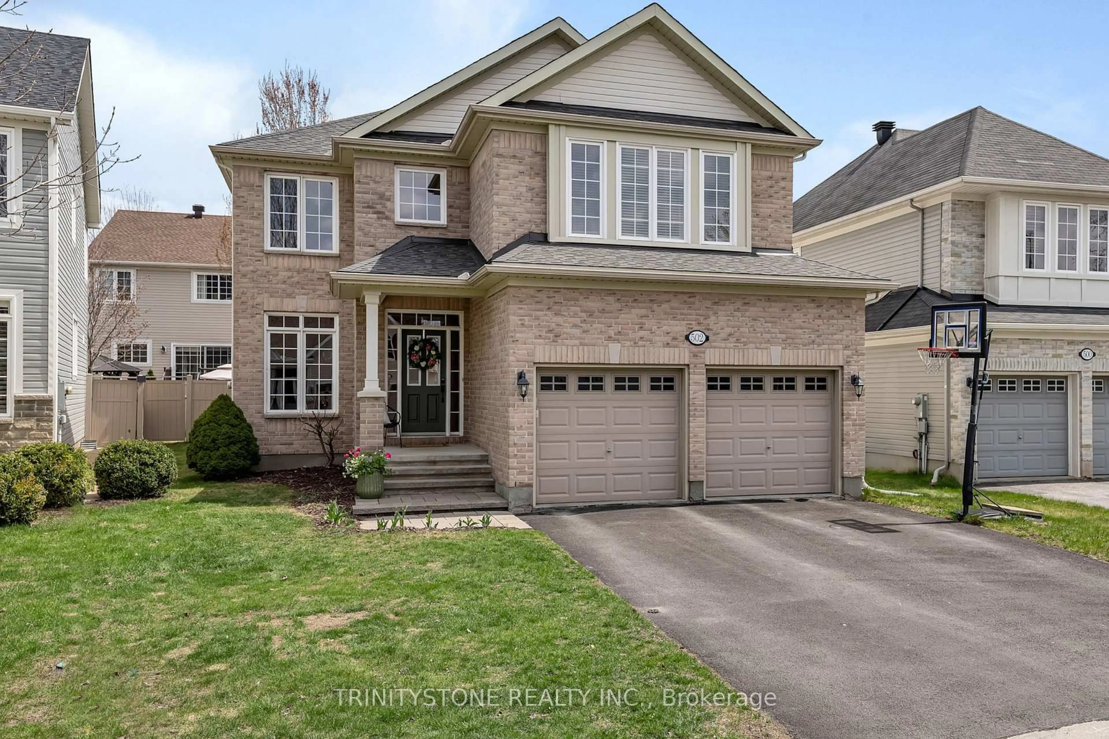 Home with brick exterior material, street for 502 Dalewood Cres, Stittsville Ontario K2S 0L2