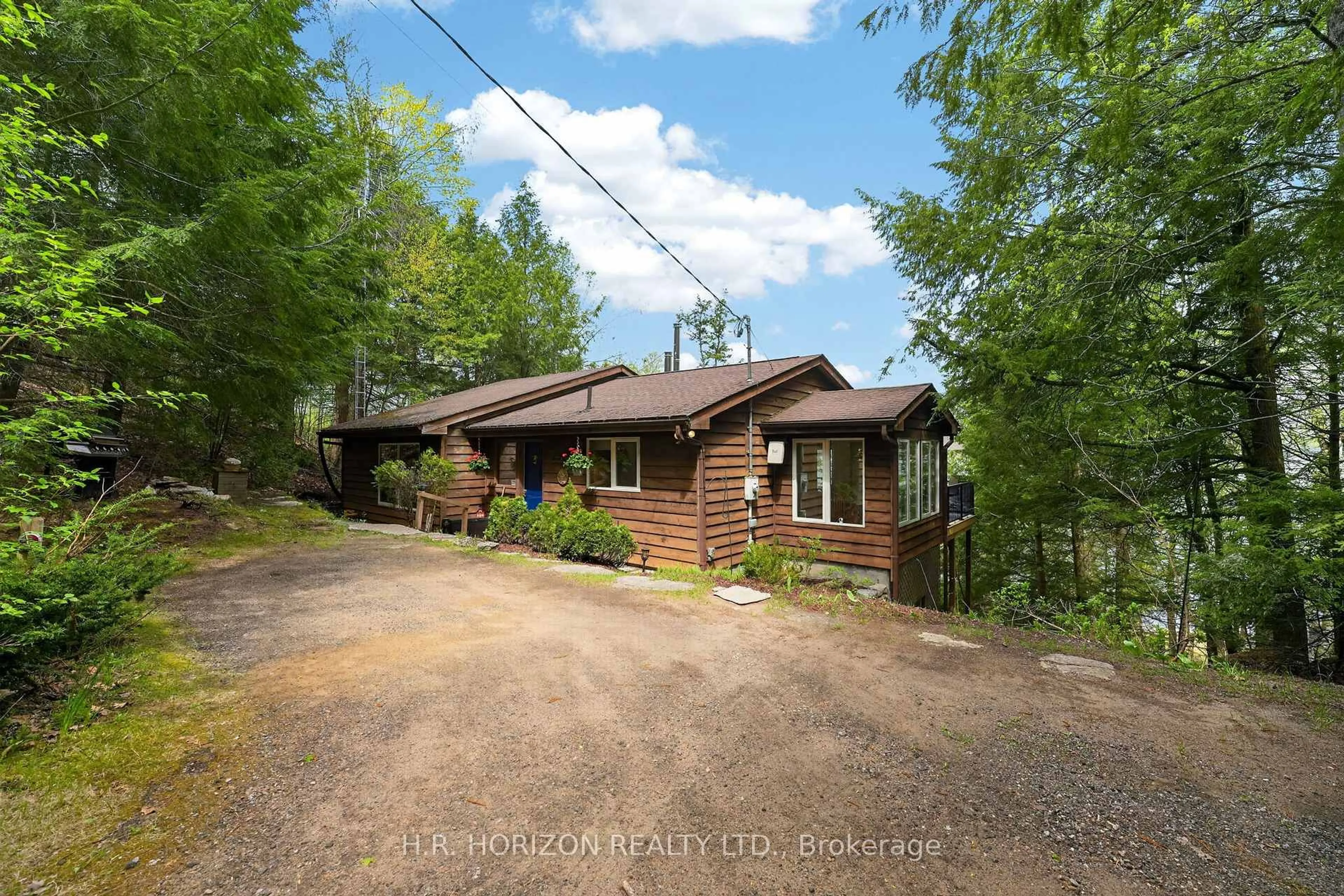 A pic from outside/outdoor area/front of a property/back of a property/a pic from drone, forest/trees view for 1029 Starlight Rd, Minden Hills Ontario K0M 2K0