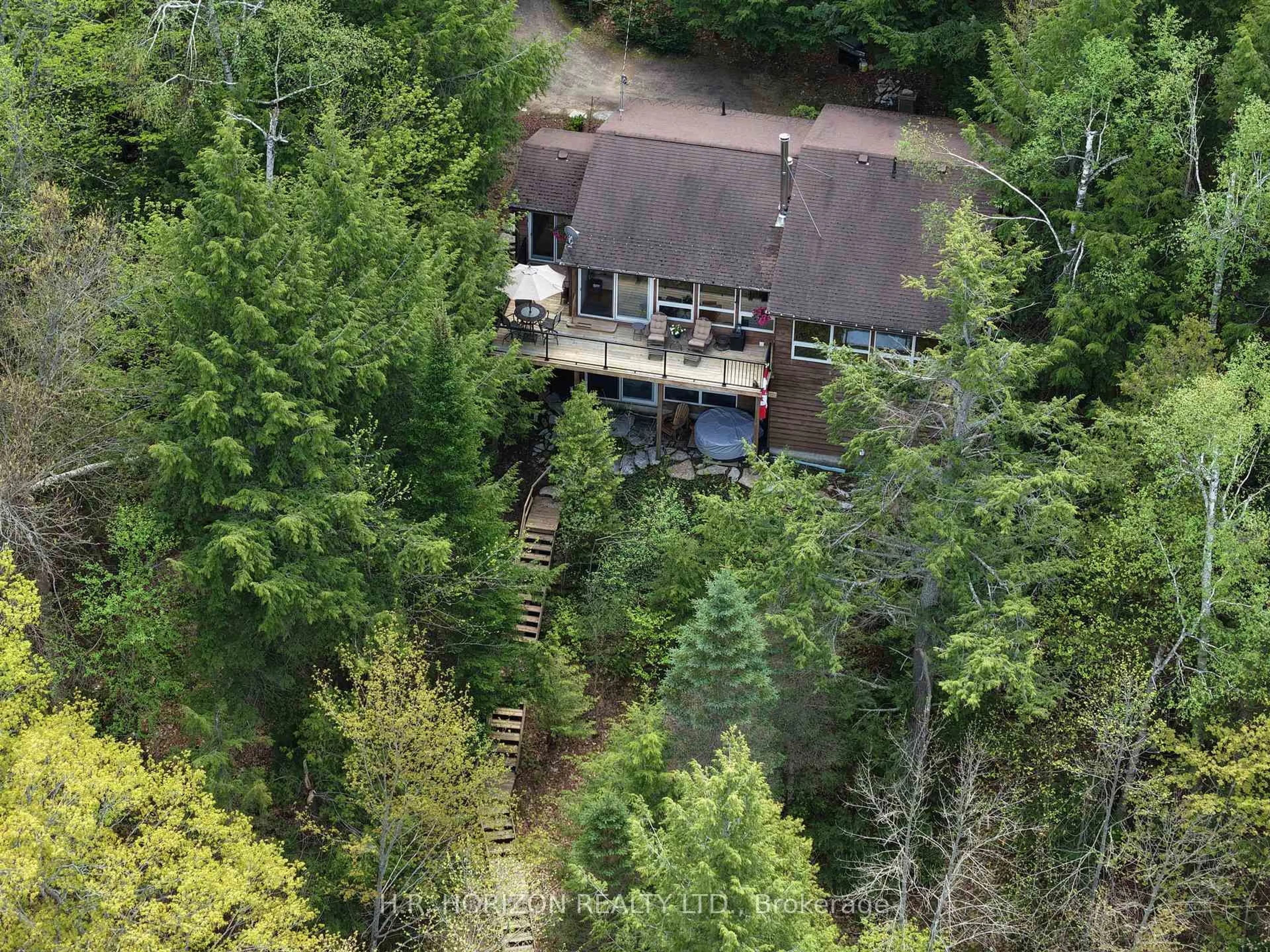 A pic from outside/outdoor area/front of a property/back of a property/a pic from drone, forest/trees view for 1029 Starlight Rd, Minden Hills Ontario K0M 2K0
