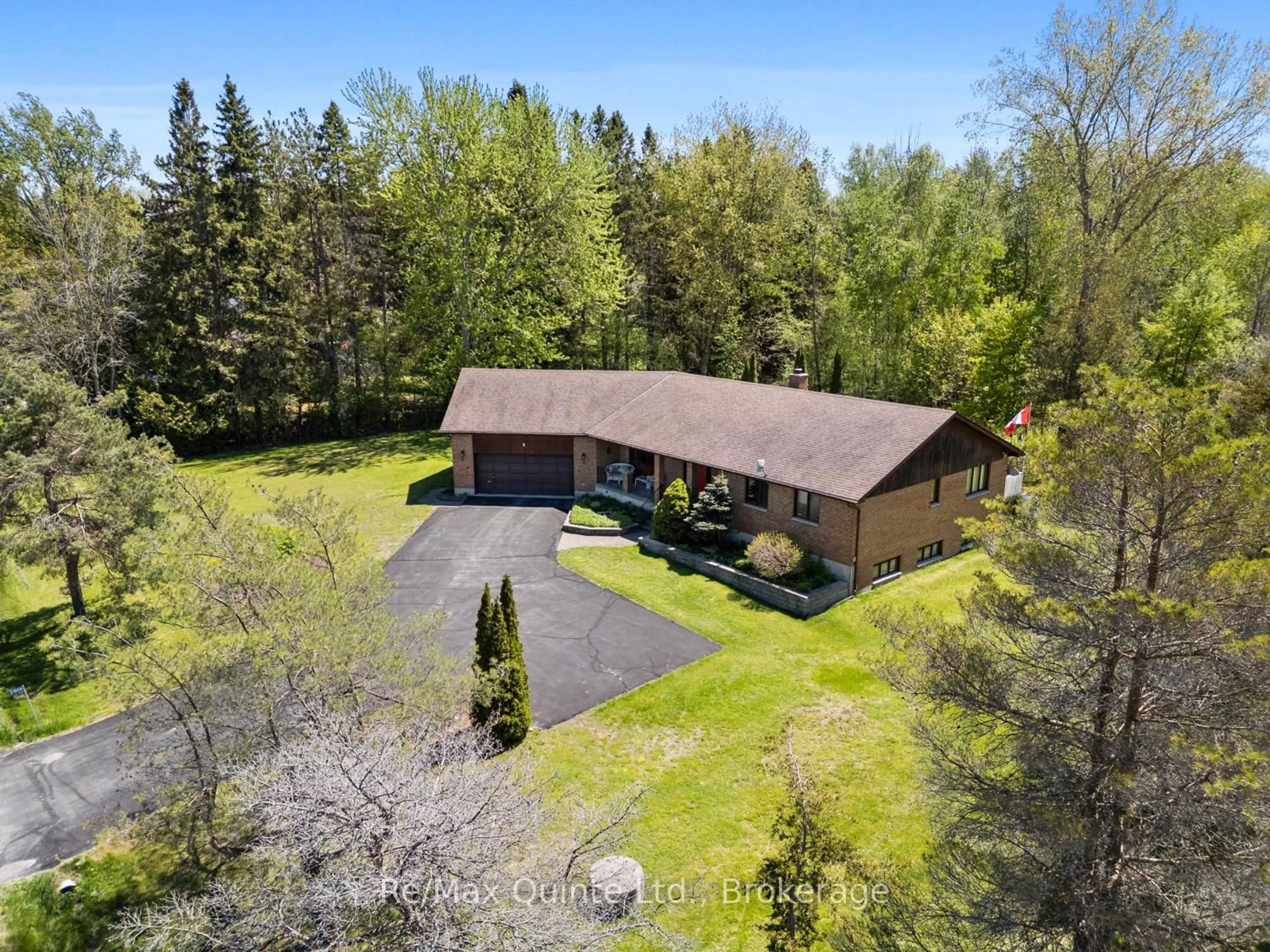 A pic from outside/outdoor area/front of a property/back of a property/a pic from drone, forest/trees view for 21858 Loyalist Pkwy, Quinte West Ontario K0K 1L0