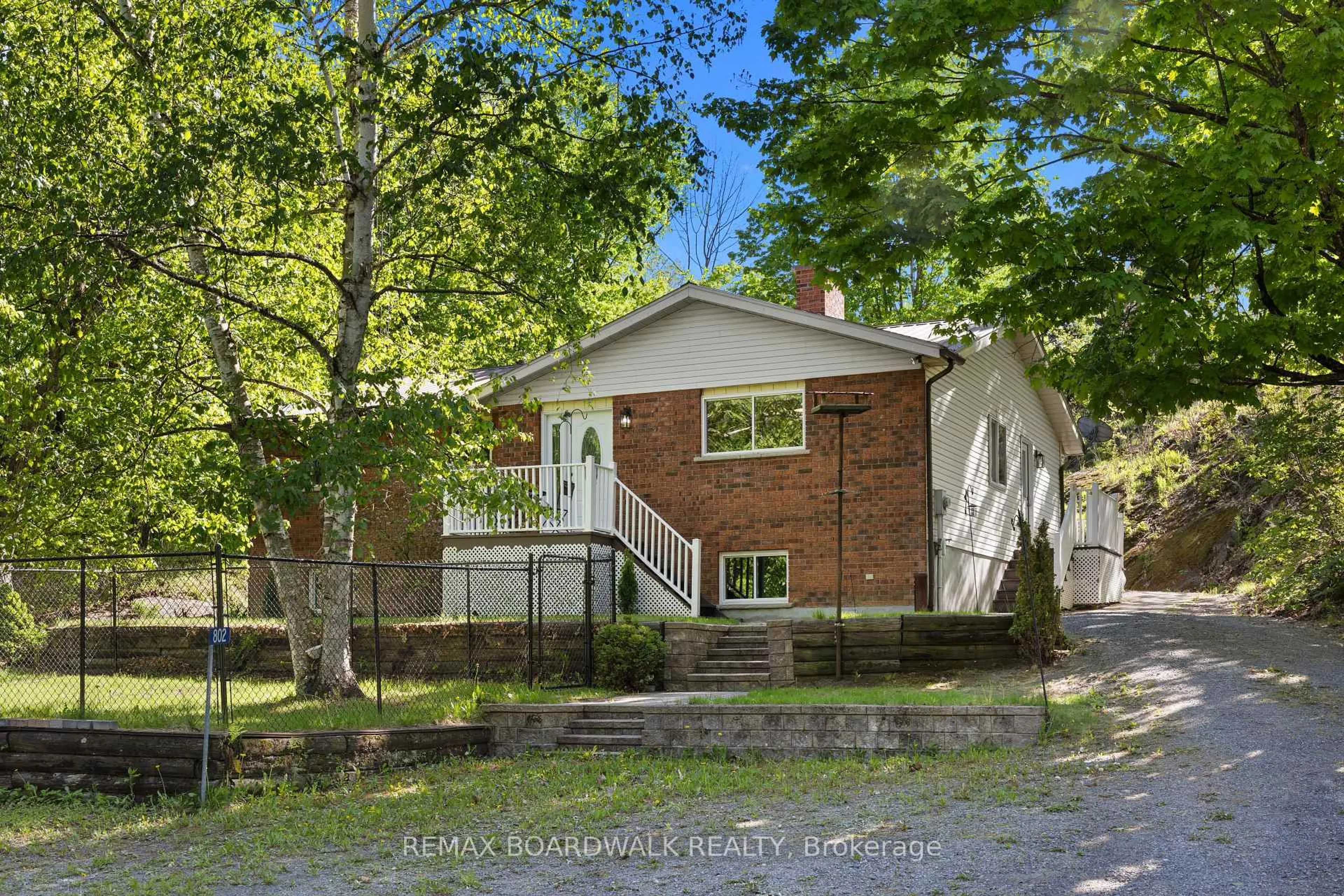 Home with brick exterior material, street for 802 Beach Lane, Leeds and the Thousand Islands Ontario K0E 1N0