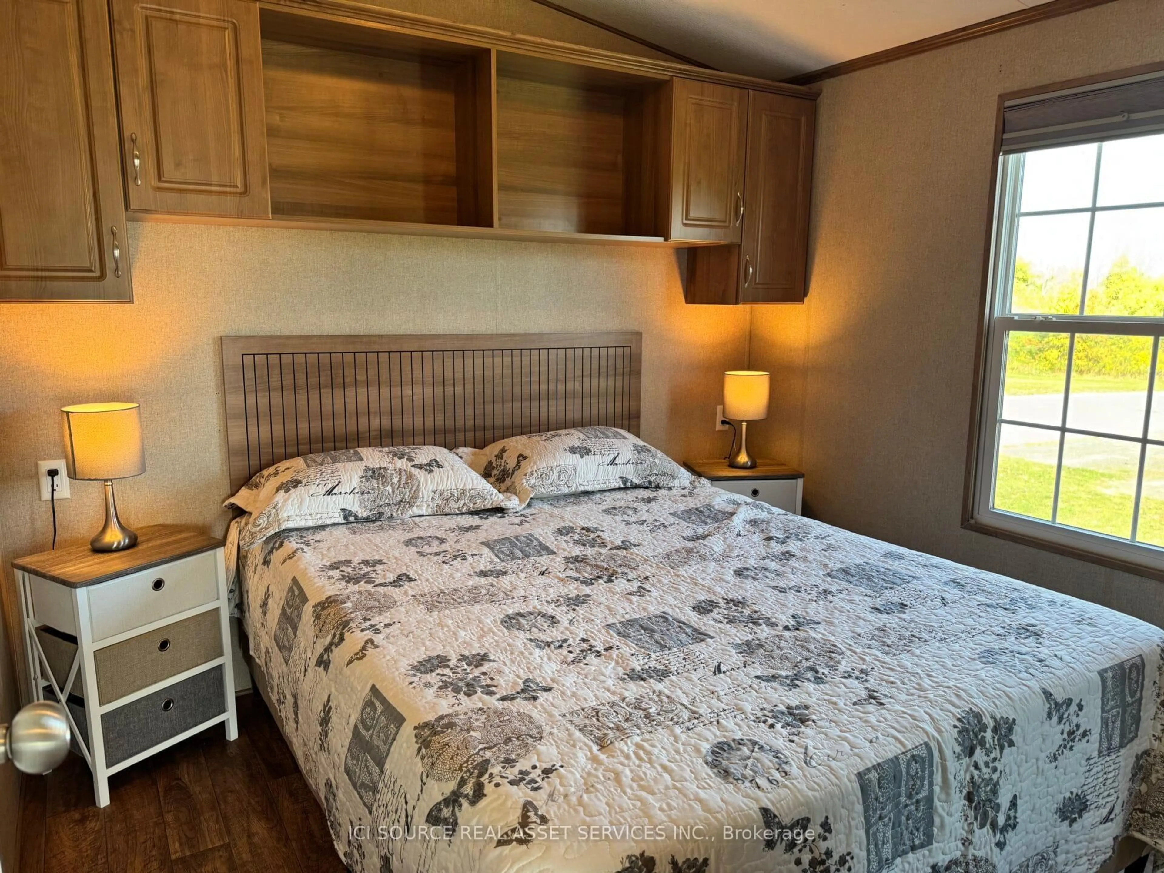 Bedroom with bed, wood/laminate floor for 1235 Villiers Line #ALX06, Otonabee-South Monaghan Ontario K0L 2G0