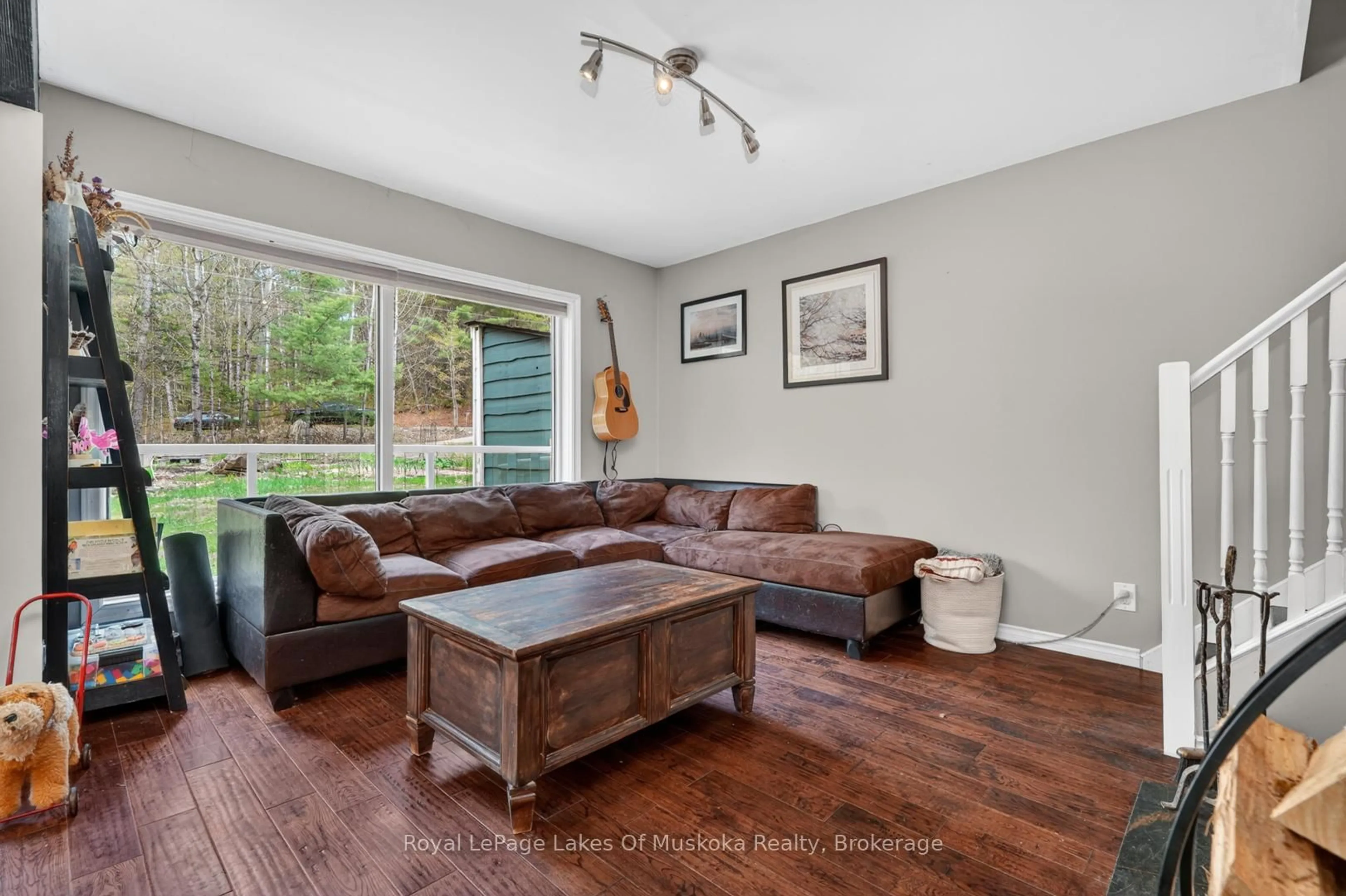 Living room with furniture, wood/laminate floor for 1034 Old 117 Highway, Lake of Bays Ontario P0B 1A0