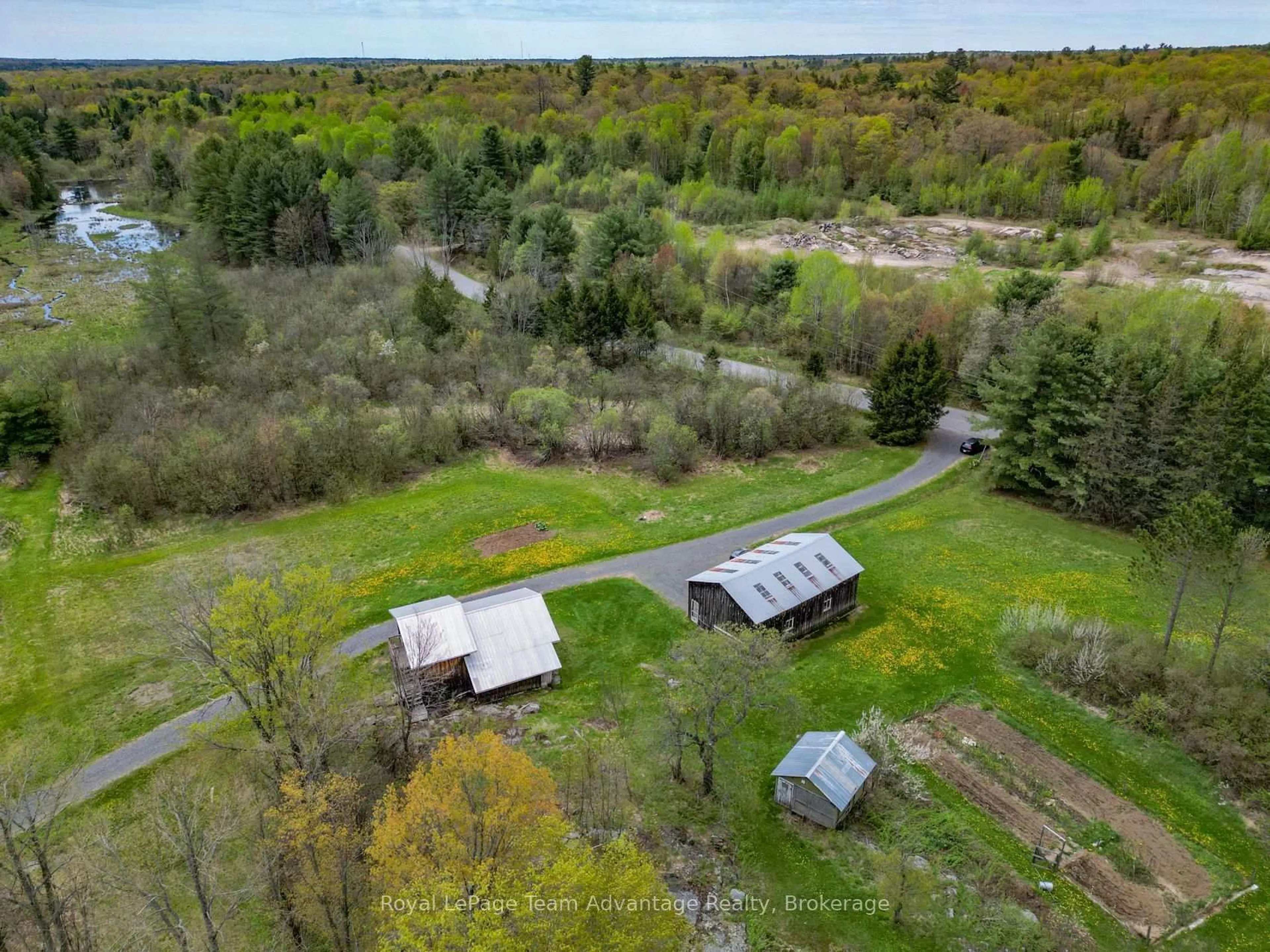 A pic from outside/outdoor area/front of a property/back of a property/a pic from drone, forest/trees view for 315 Lorimer Lake Rd, McDougall Ontario P2A 2W7