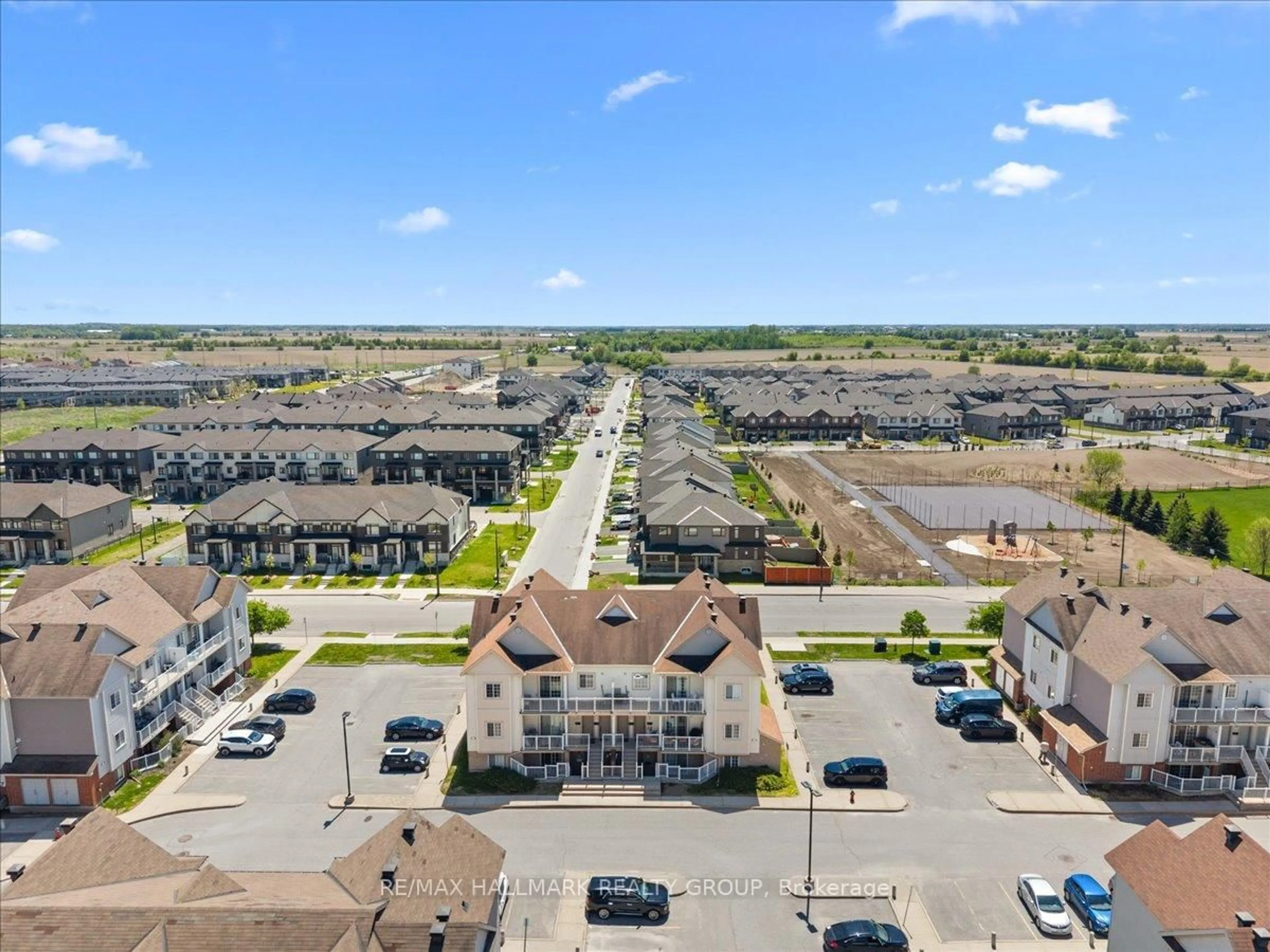 A pic from outside/outdoor area/front of a property/back of a property/a pic from drone, street for 102 Artesa Private #I, Ottawa Ontario K2S 0J8