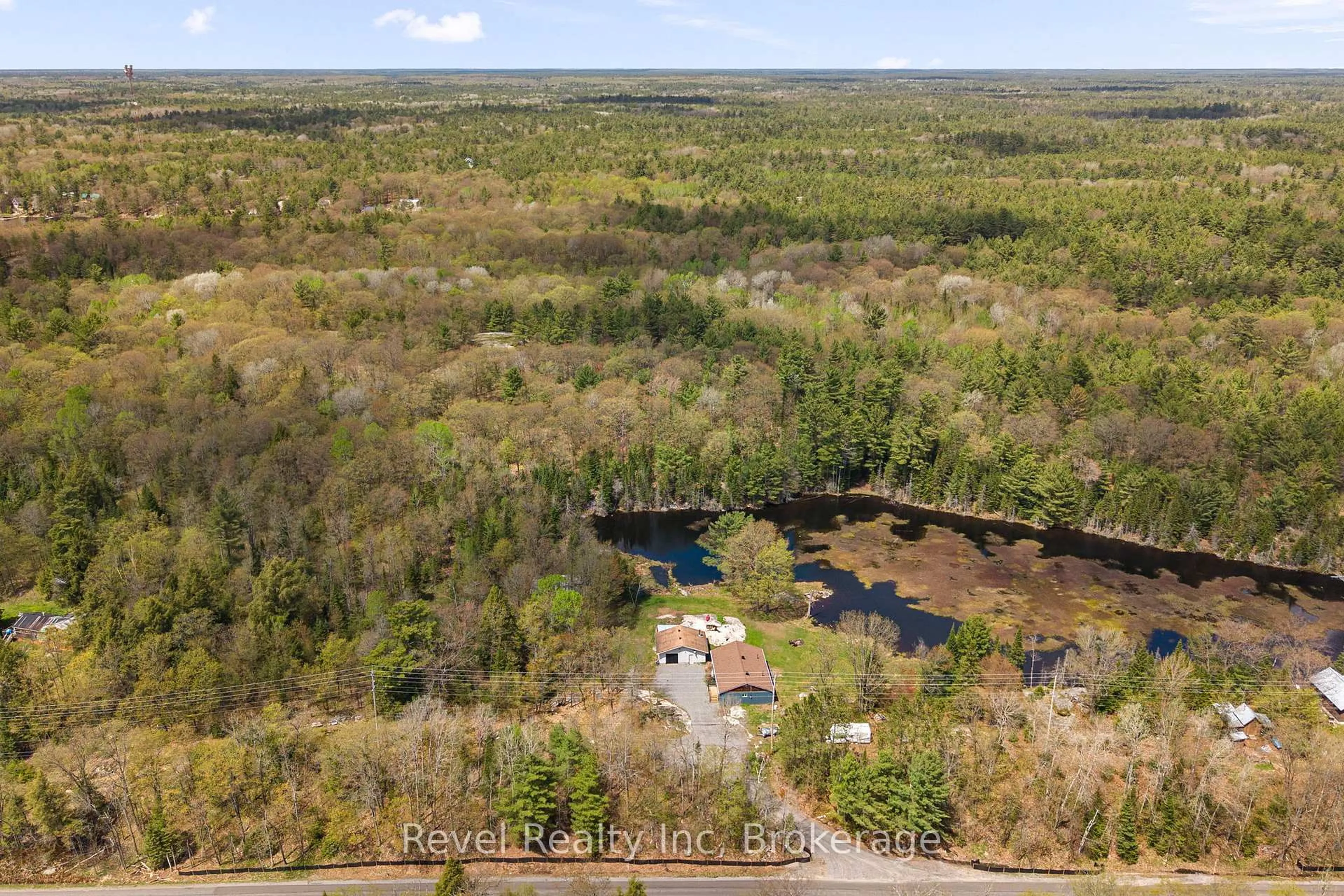 A pic from outside/outdoor area/front of a property/back of a property/a pic from drone, water/lake/river/ocean view for 115 559 Highway, Carling Ontario P0G 1G0