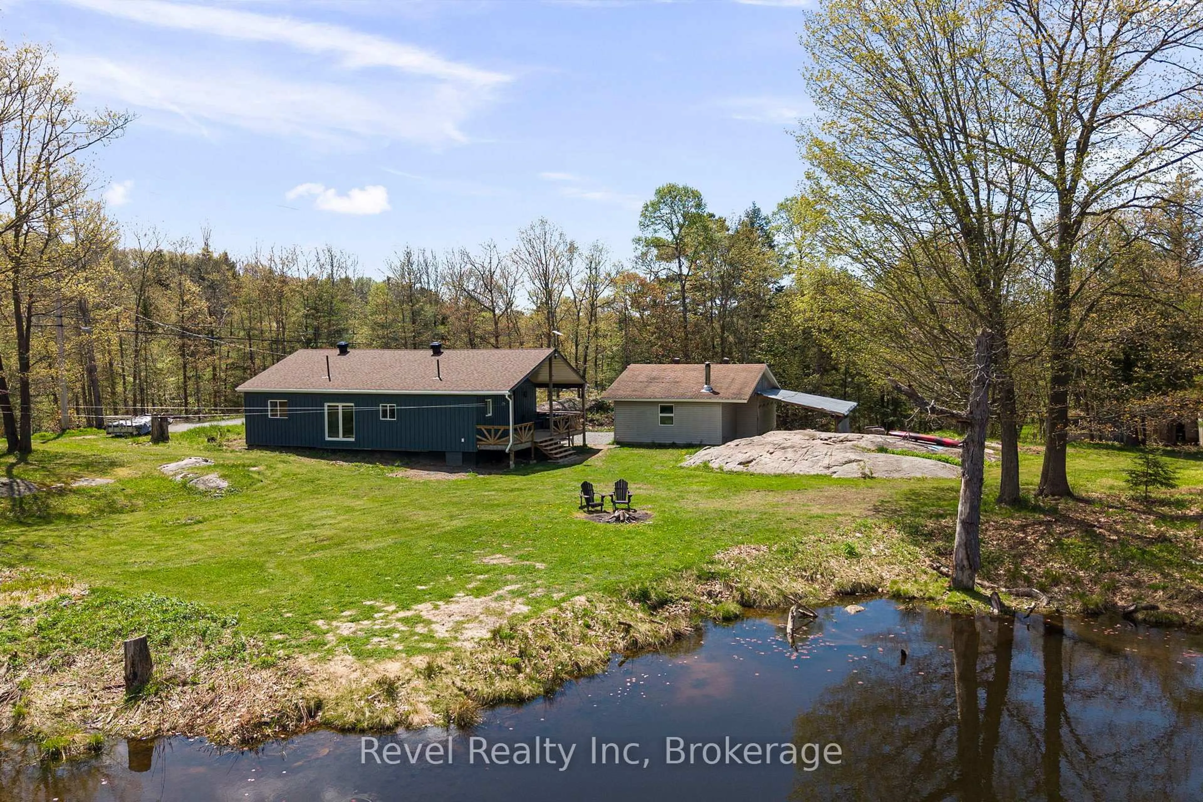 A pic from outside/outdoor area/front of a property/back of a property/a pic from drone, water/lake/river/ocean view for 115 559 Highway, Carling Ontario P0G 1G0