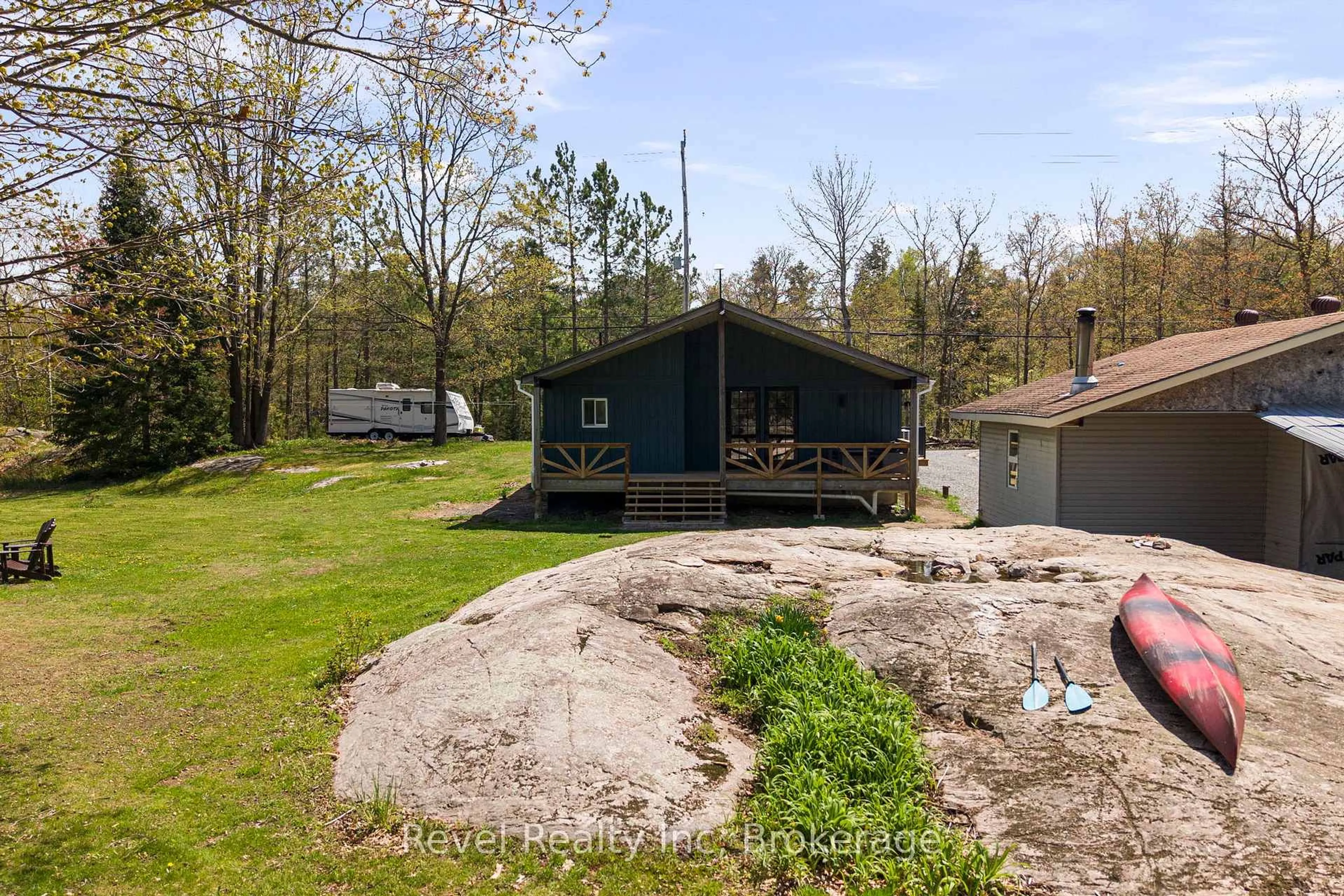 A pic from outside/outdoor area/front of a property/back of a property/a pic from drone, water/lake/river/ocean view for 115 559 Highway, Carling Ontario P0G 1G0