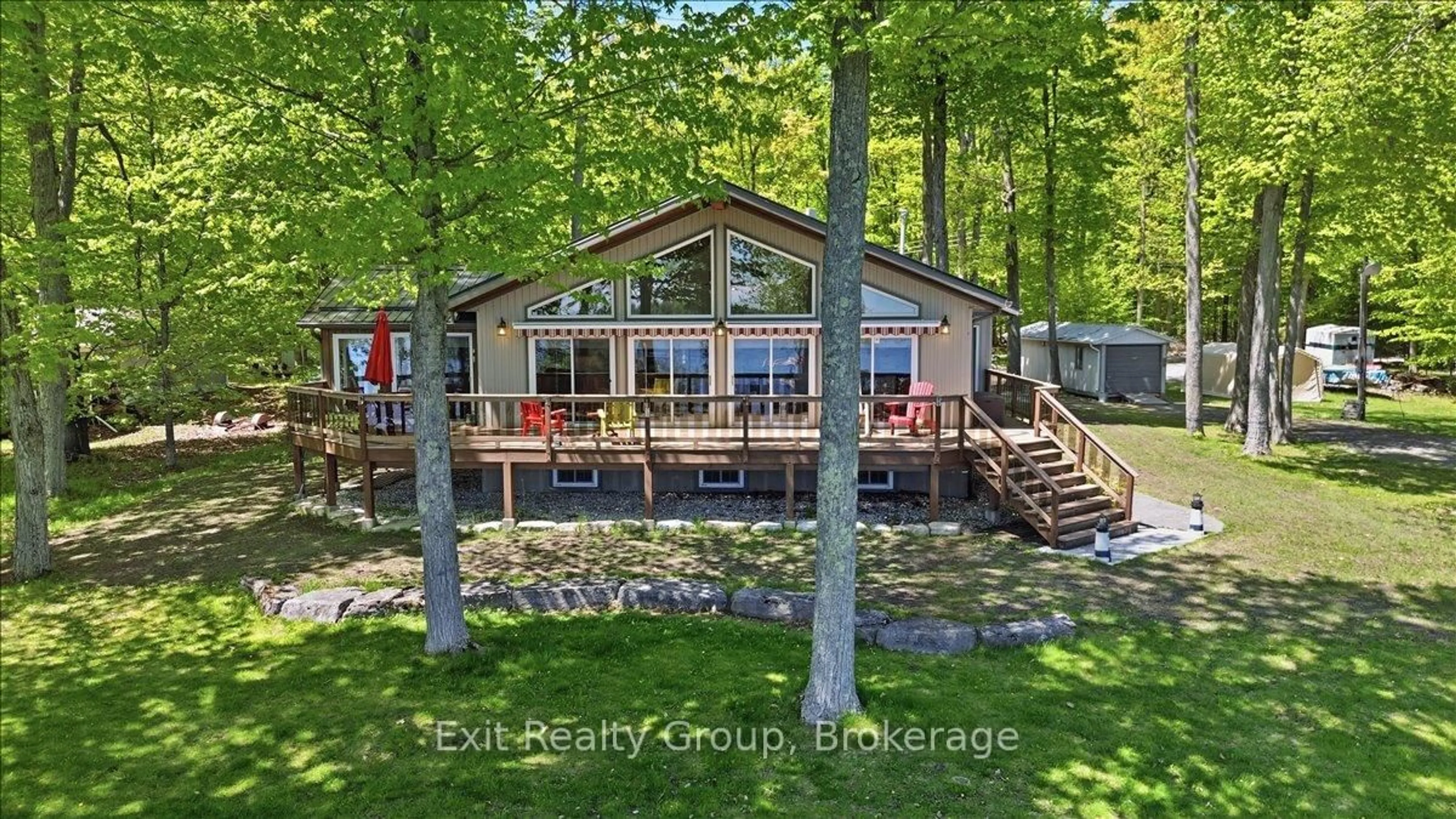 A pic from outside/outdoor area/front of a property/back of a property/a pic from drone, water/lake/river/ocean view for 919 Cook Rd, Limoges Ontario K0K 2M0