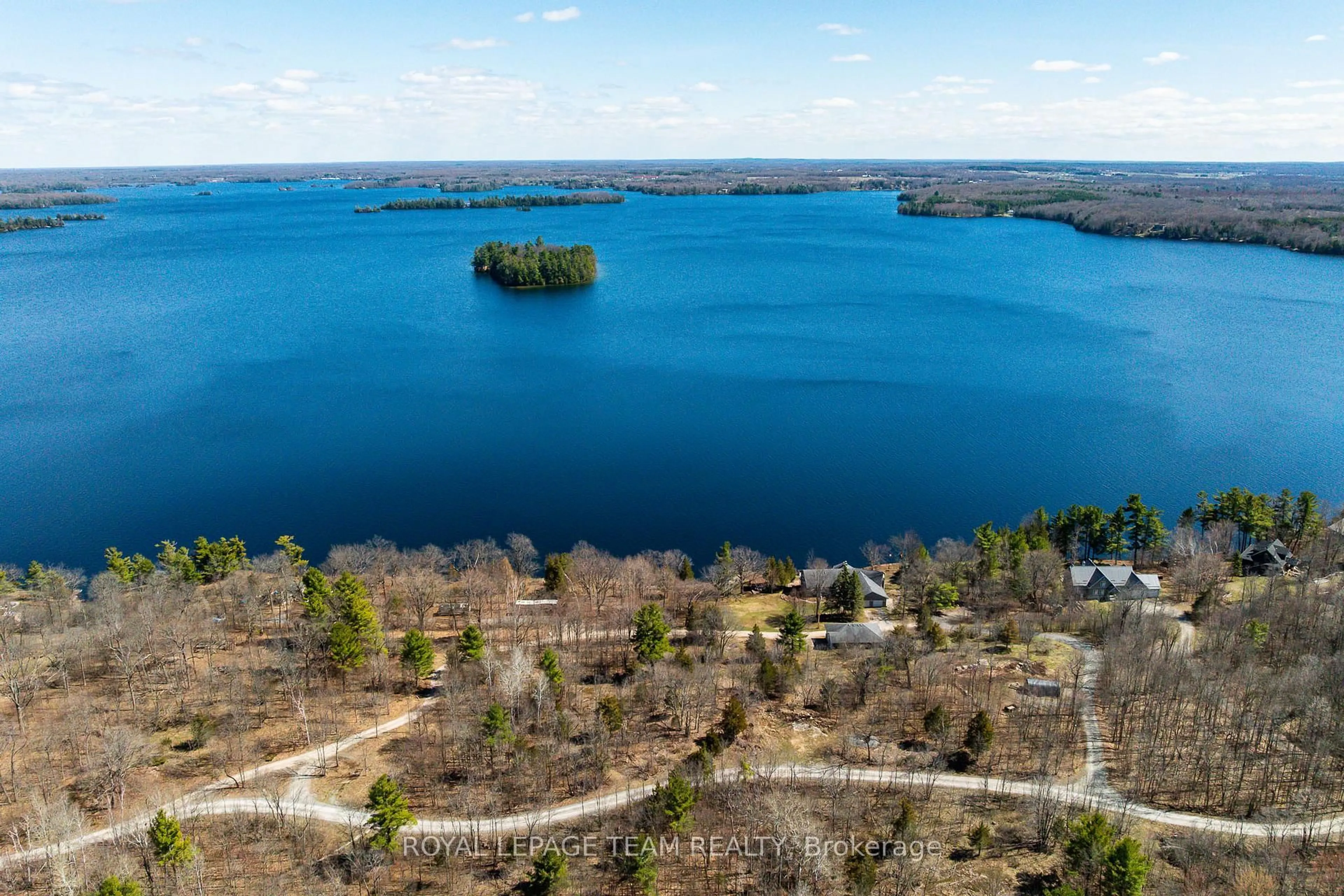 A pic from outside/outdoor area/front of a property/back of a property/a pic from drone, water/lake/river/ocean view for 605 Big Rideau North Shore Rd, Perth Ontario K7H 3C5