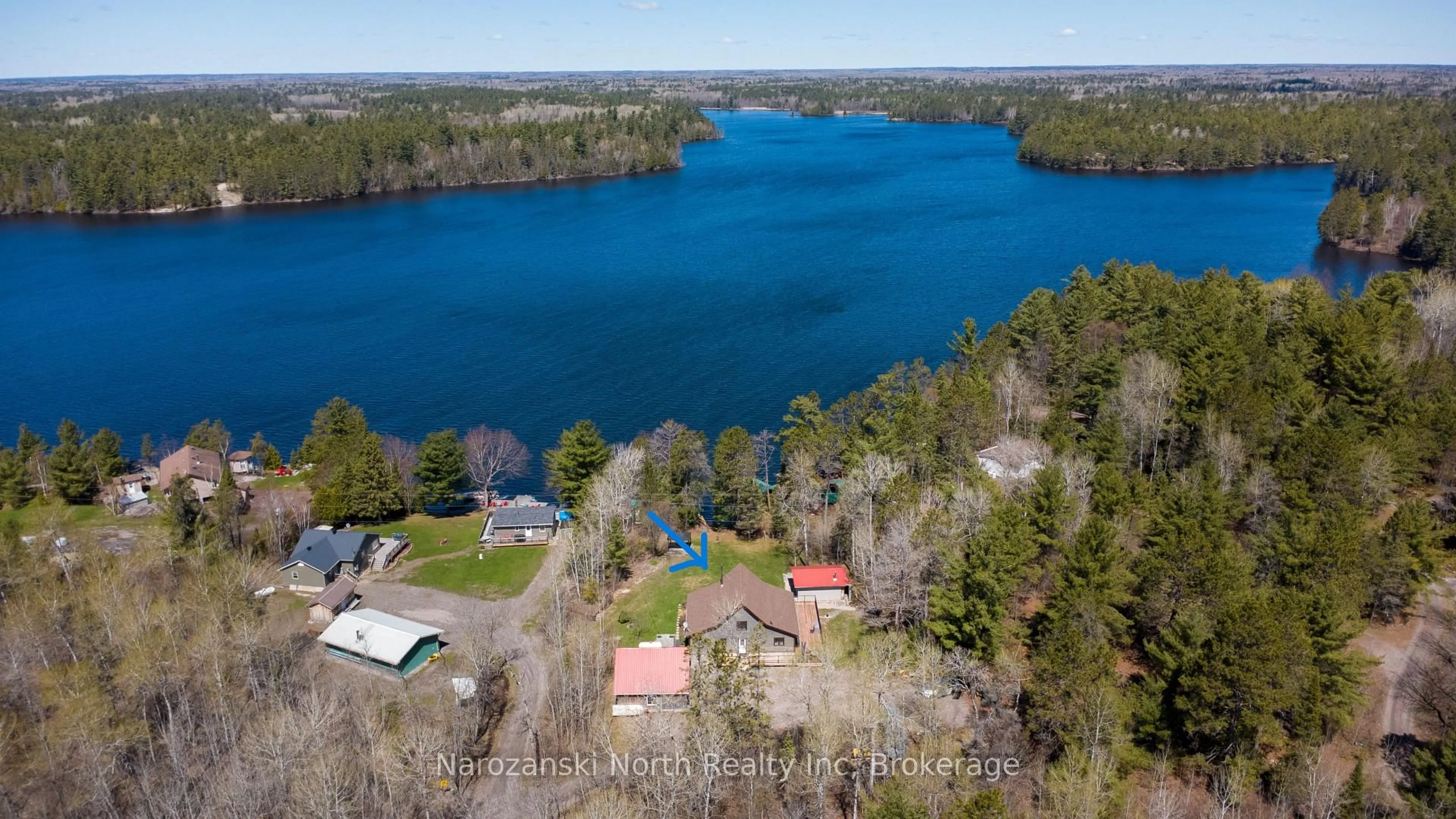 A pic from outside/outdoor area/front of a property/back of a property/a pic from drone, water/lake/river/ocean view for 69 C Dumart Private, French River Ontario P0M 2K0