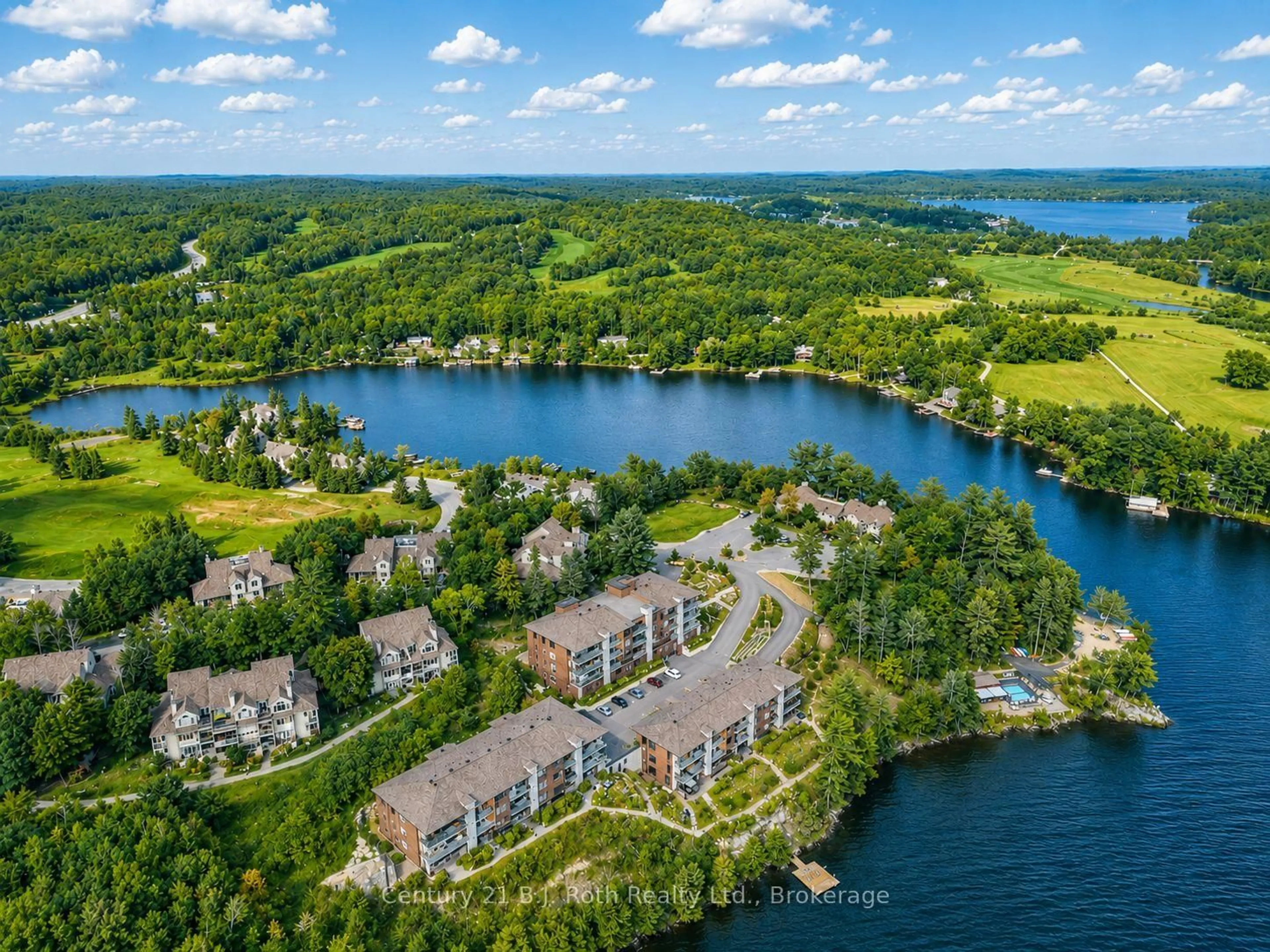 A pic from outside/outdoor area/front of a property/back of a property/a pic from drone, water/lake/river/ocean view for 727 Grandview Dr #104, Huntsville Ontario P1H 2J5