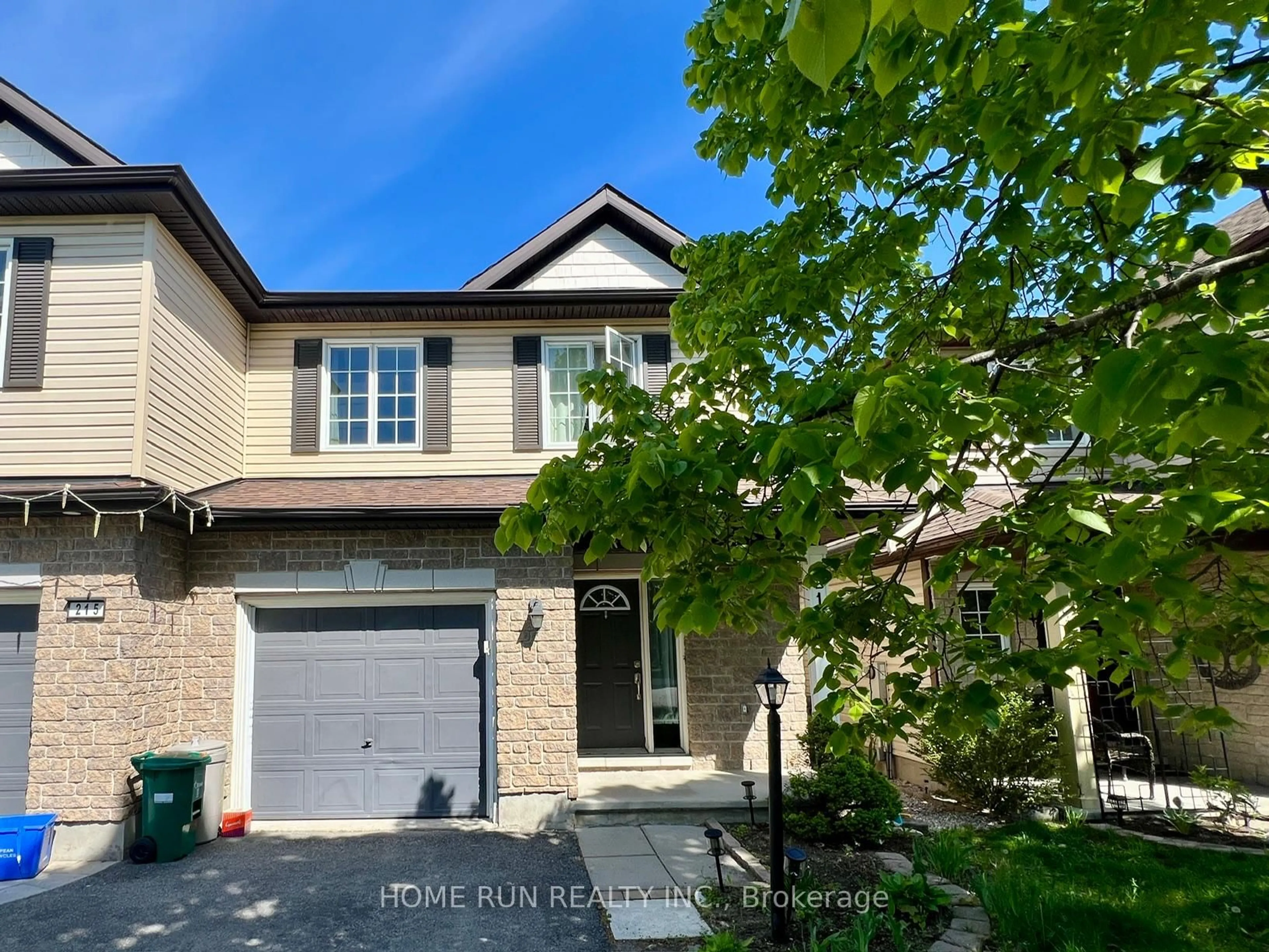 Home with brick exterior material, street for 217 Deerfox Dr, Ottawa Ontario K2J 4W8