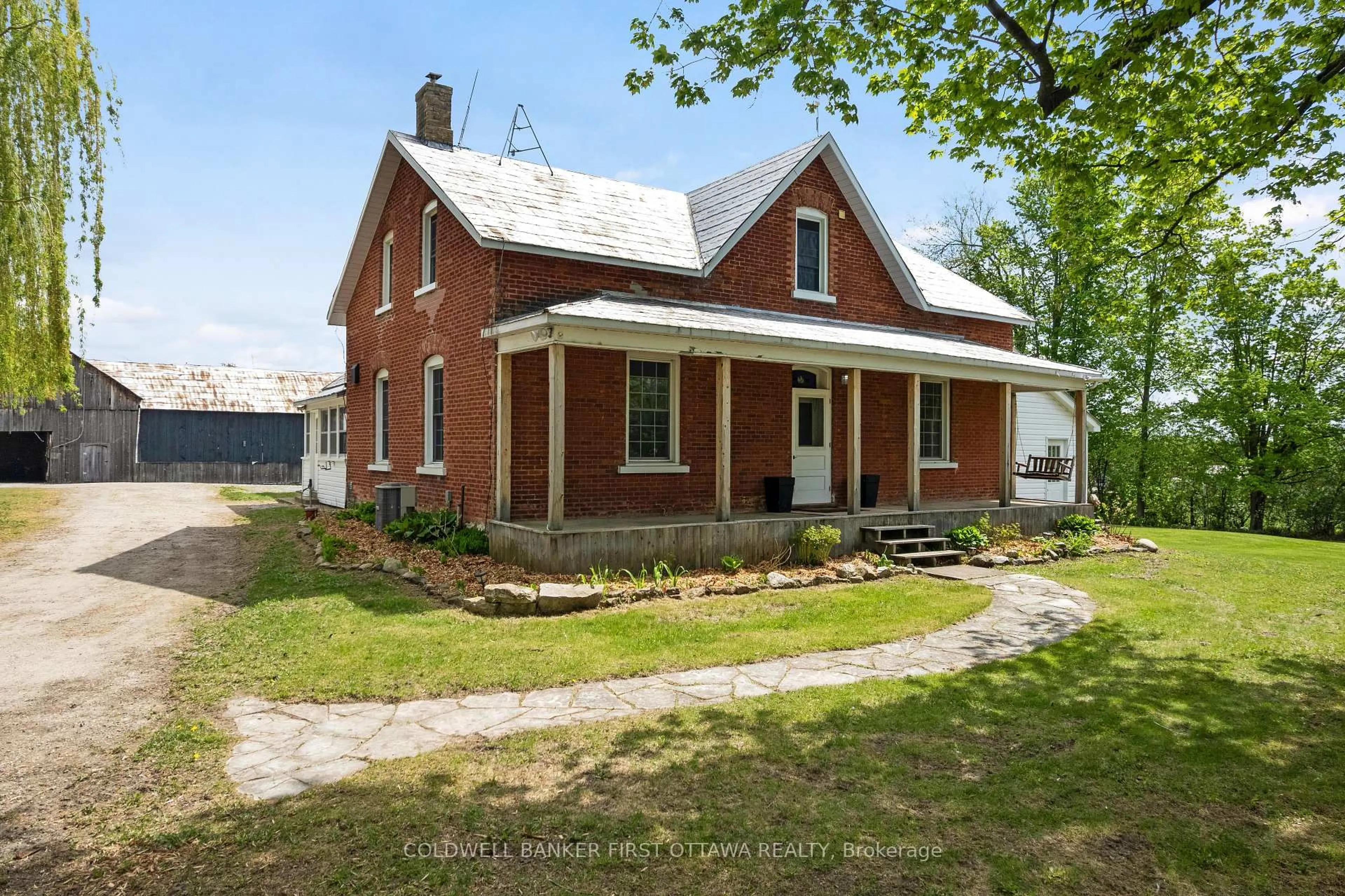 Home with brick exterior material, street for 898 Highway 511, Perth Ontario K7H 3C9