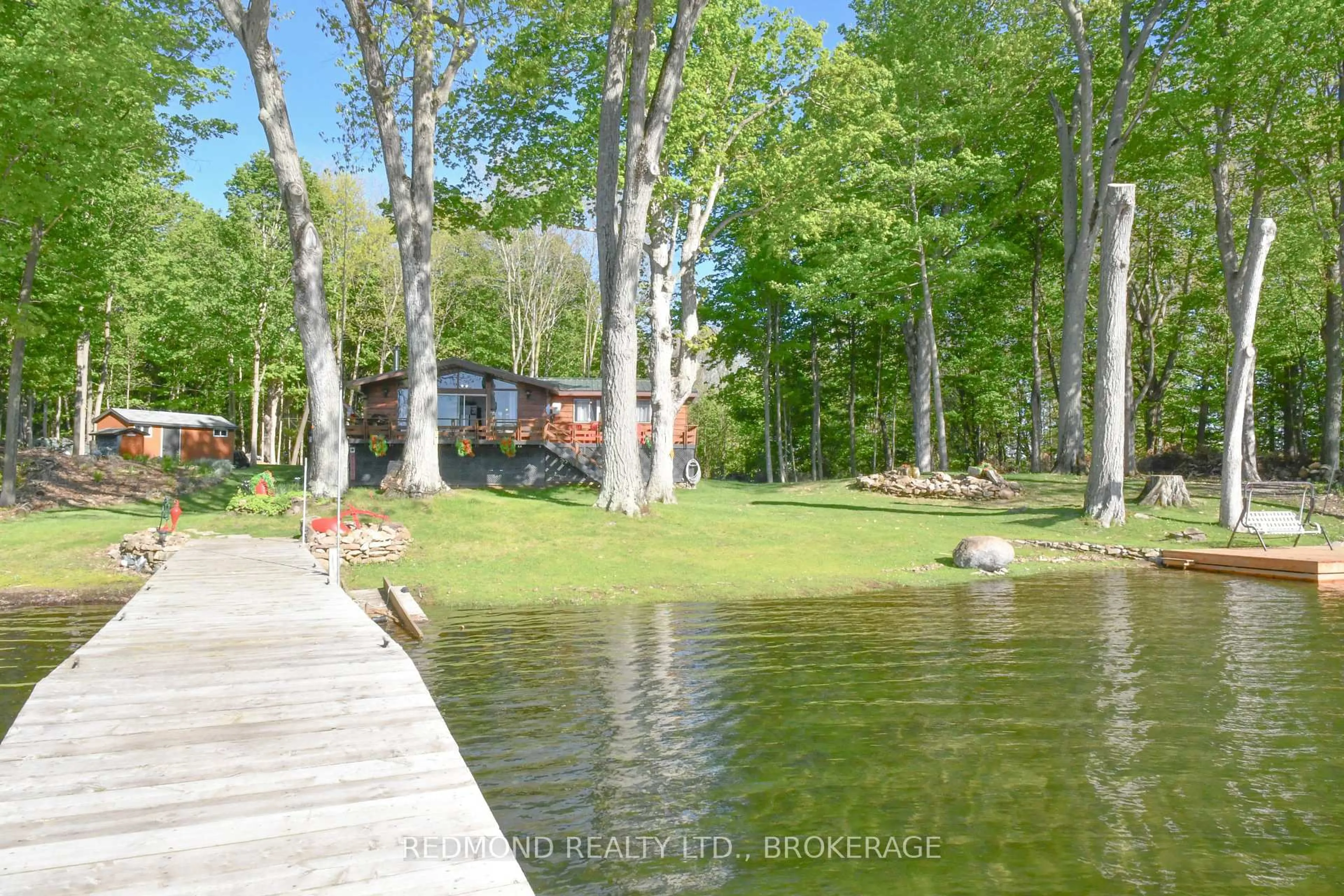 A pic from outside/outdoor area/front of a property/back of a property/a pic from drone, water/lake/river/ocean view for 4 Tremont Park Island, Frontenac Islands Ontario K7G 3C9