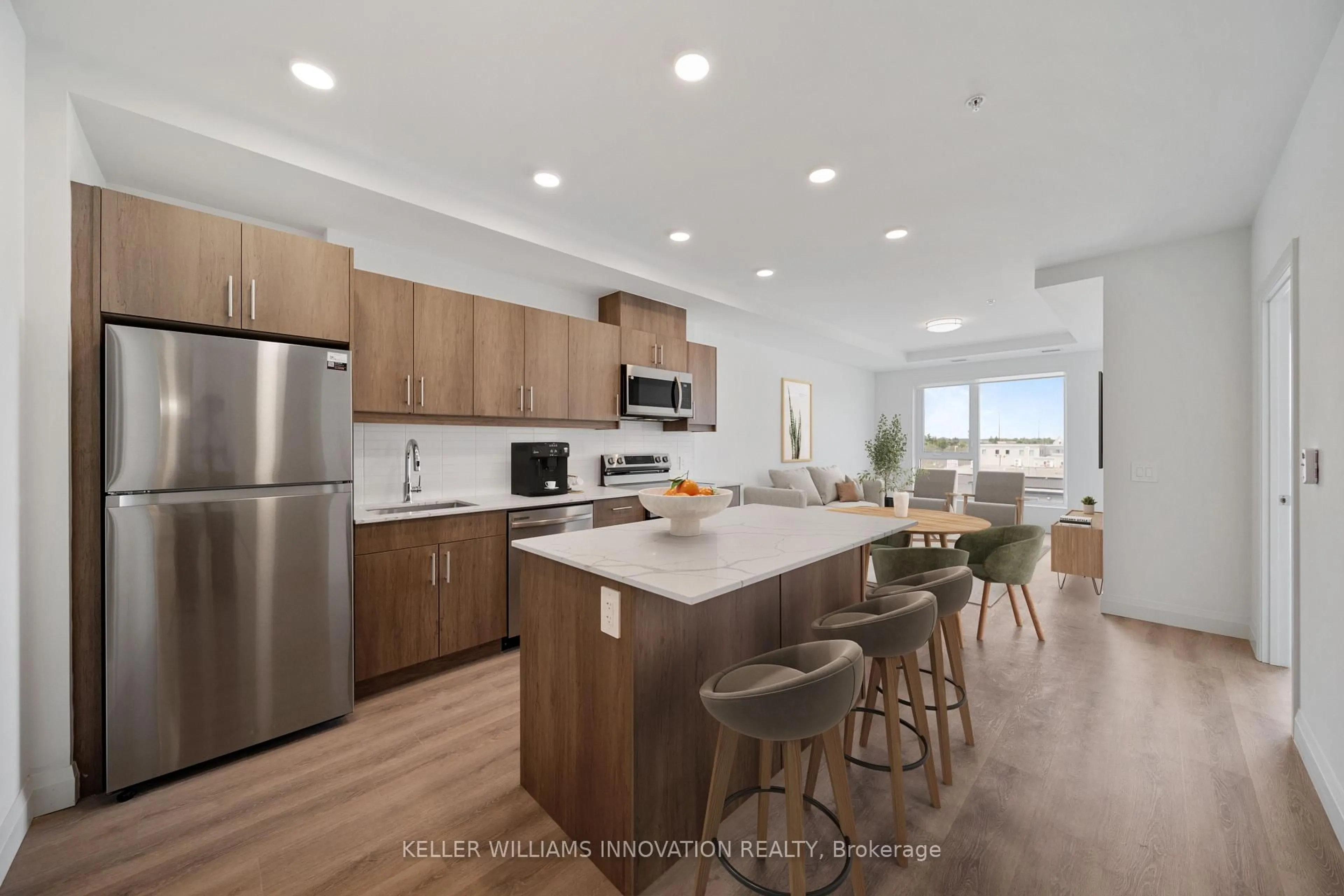 Open concept kitchen, wood/laminate floor for 1333 Weber St #316, Kitchener Ontario N2A 1C2