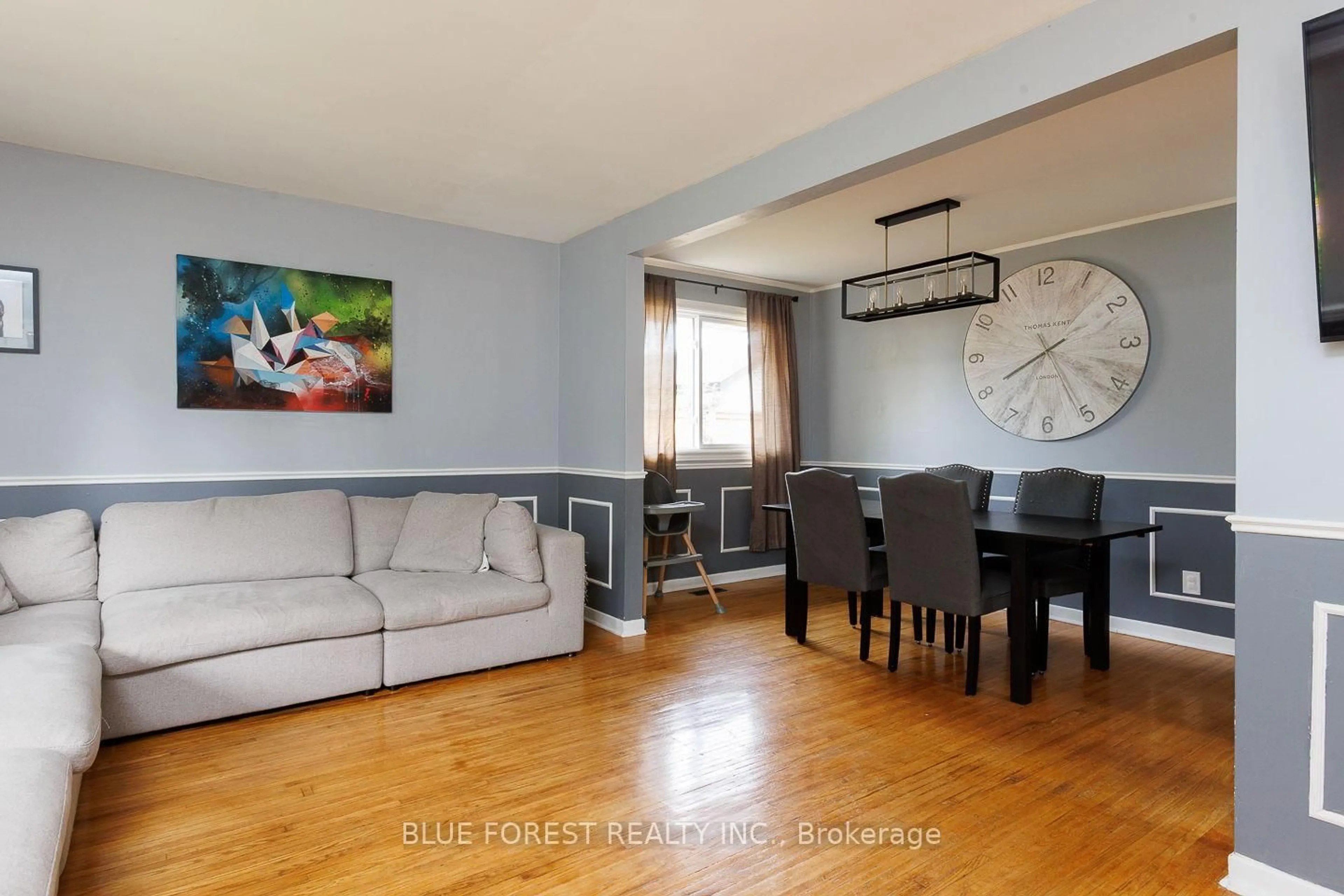 Living room with furniture, wood/laminate floor for 2 Surrey Cres, London South Ontario N6E 1T6