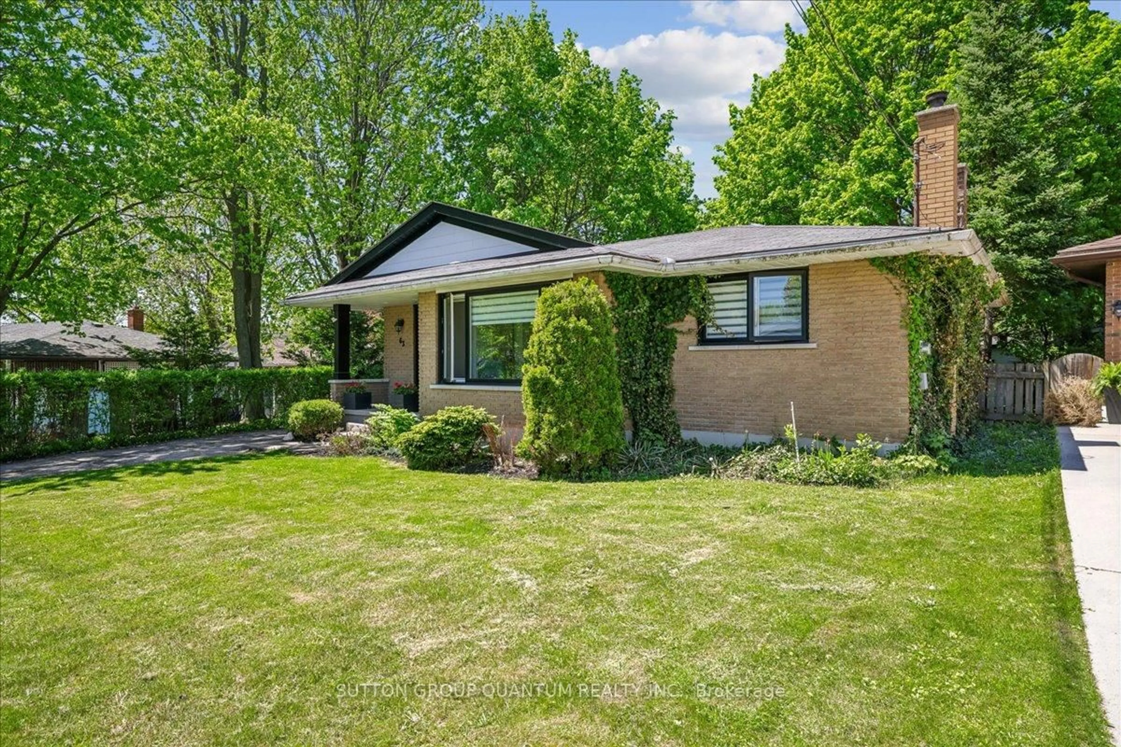 Home with brick exterior material, street for 63 Algoma Dr, Guelph Ontario N1E 1C8