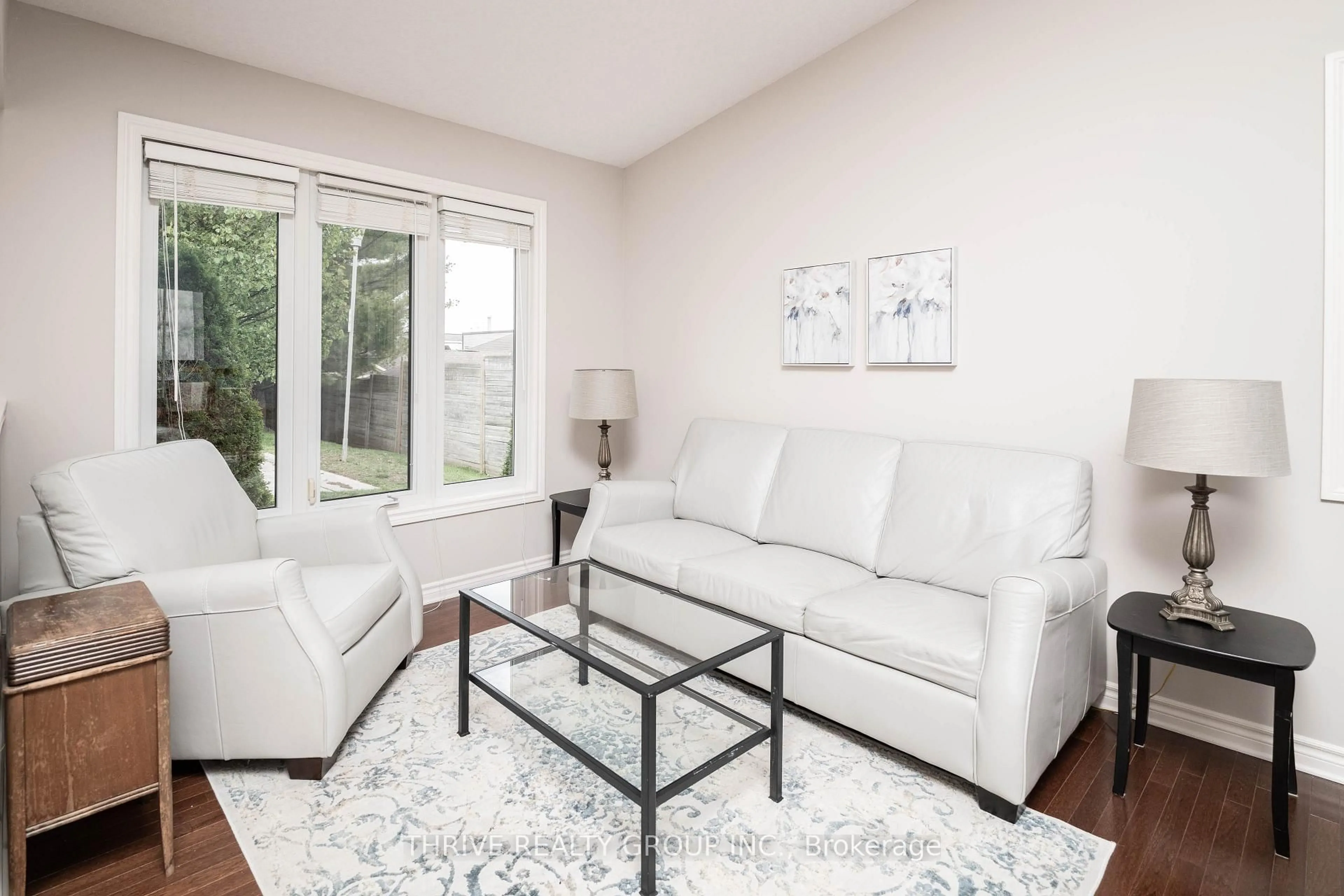 Living room with furniture, wood/laminate floor for 43 Capulet Walk #24, London North Ontario N6H 5V4