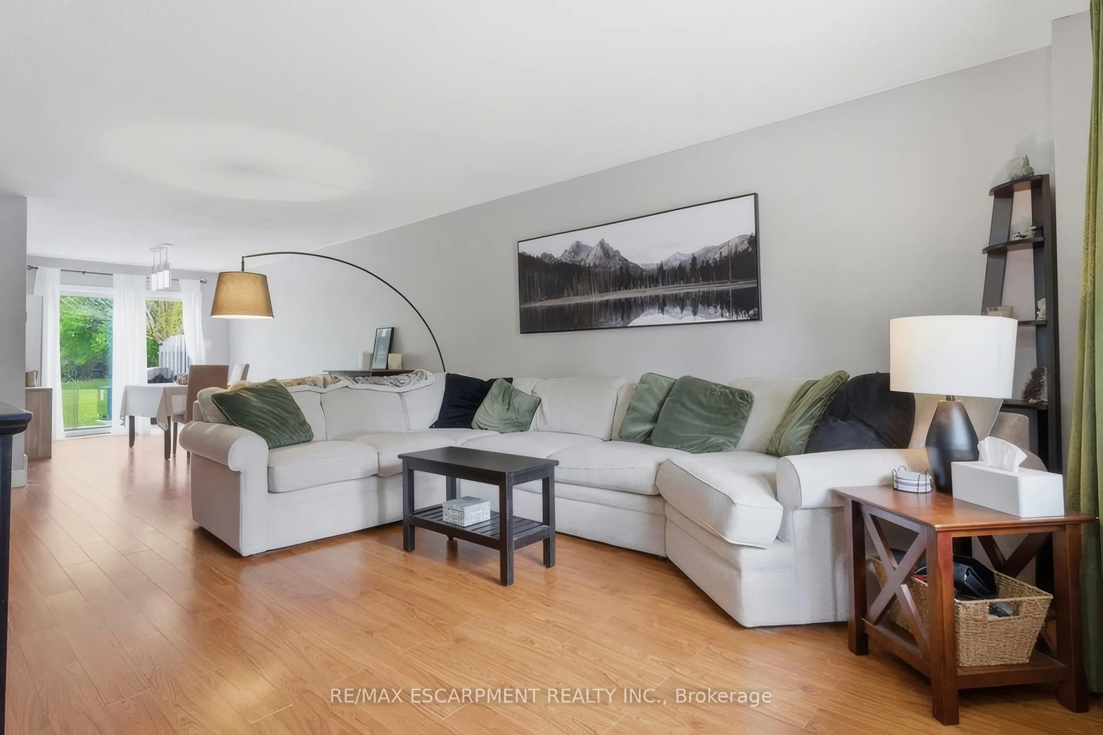 Living room with furniture, wood/laminate floor for 653 Albert St #K, Waterloo Ontario N2L 3V5