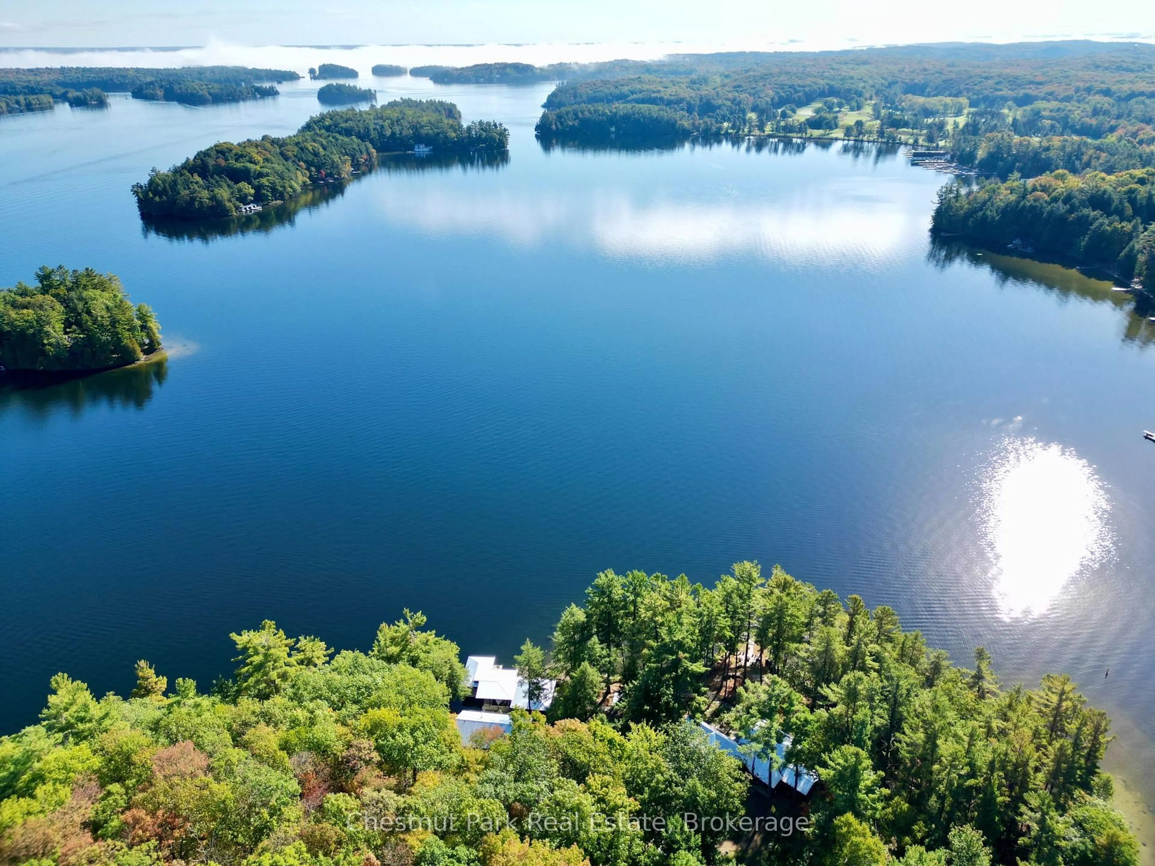 A pic from outside/outdoor area/front of a property/back of a property/a pic from drone, water/lake/river/ocean view for 5 Is Beacon Island, Muskoka Lakes Ontario P0B 1J0