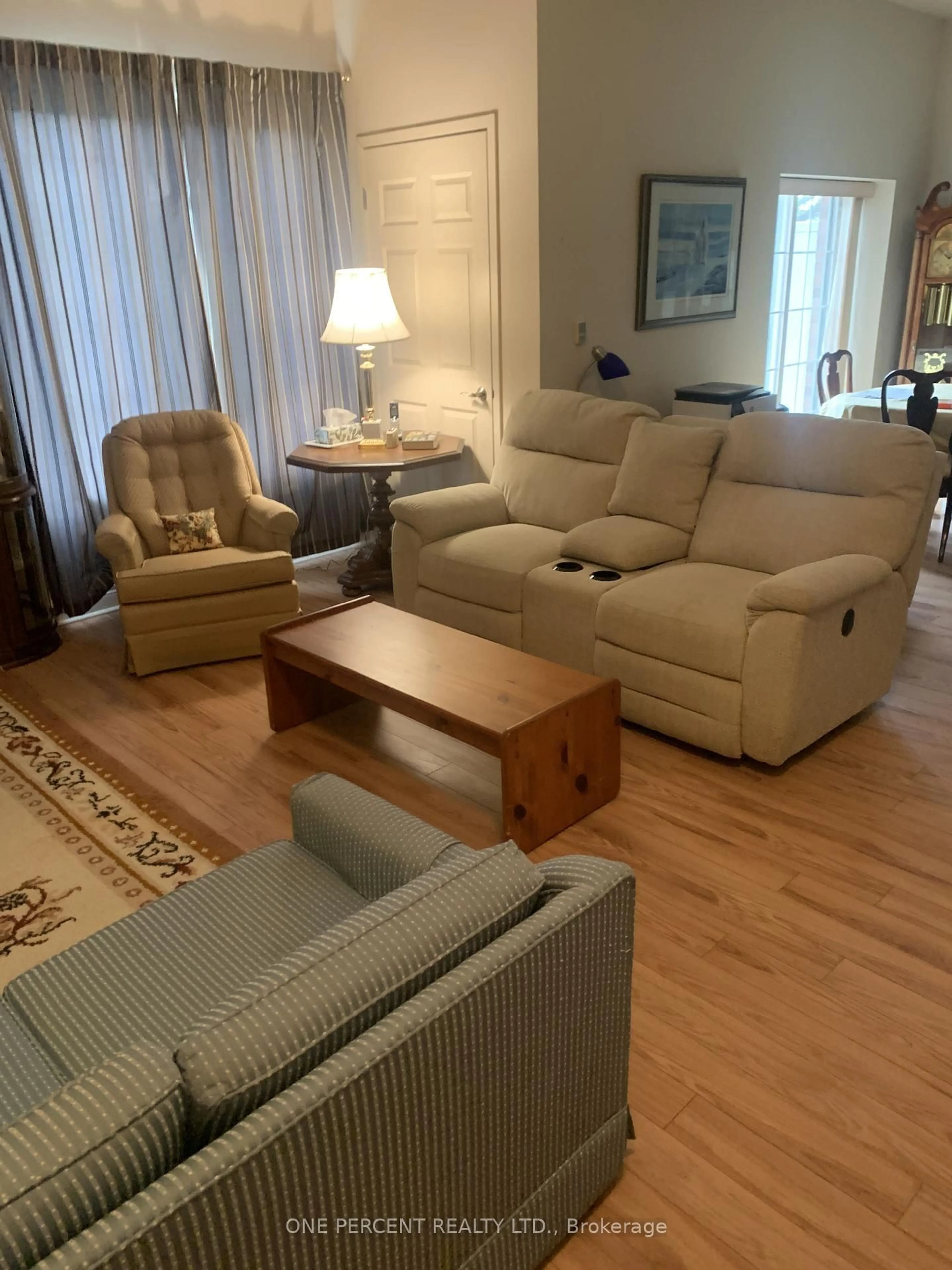 Living room with furniture, wood/laminate floor for 200 MCCARTHY Rd #164, Stratford Ontario N5A 0B6