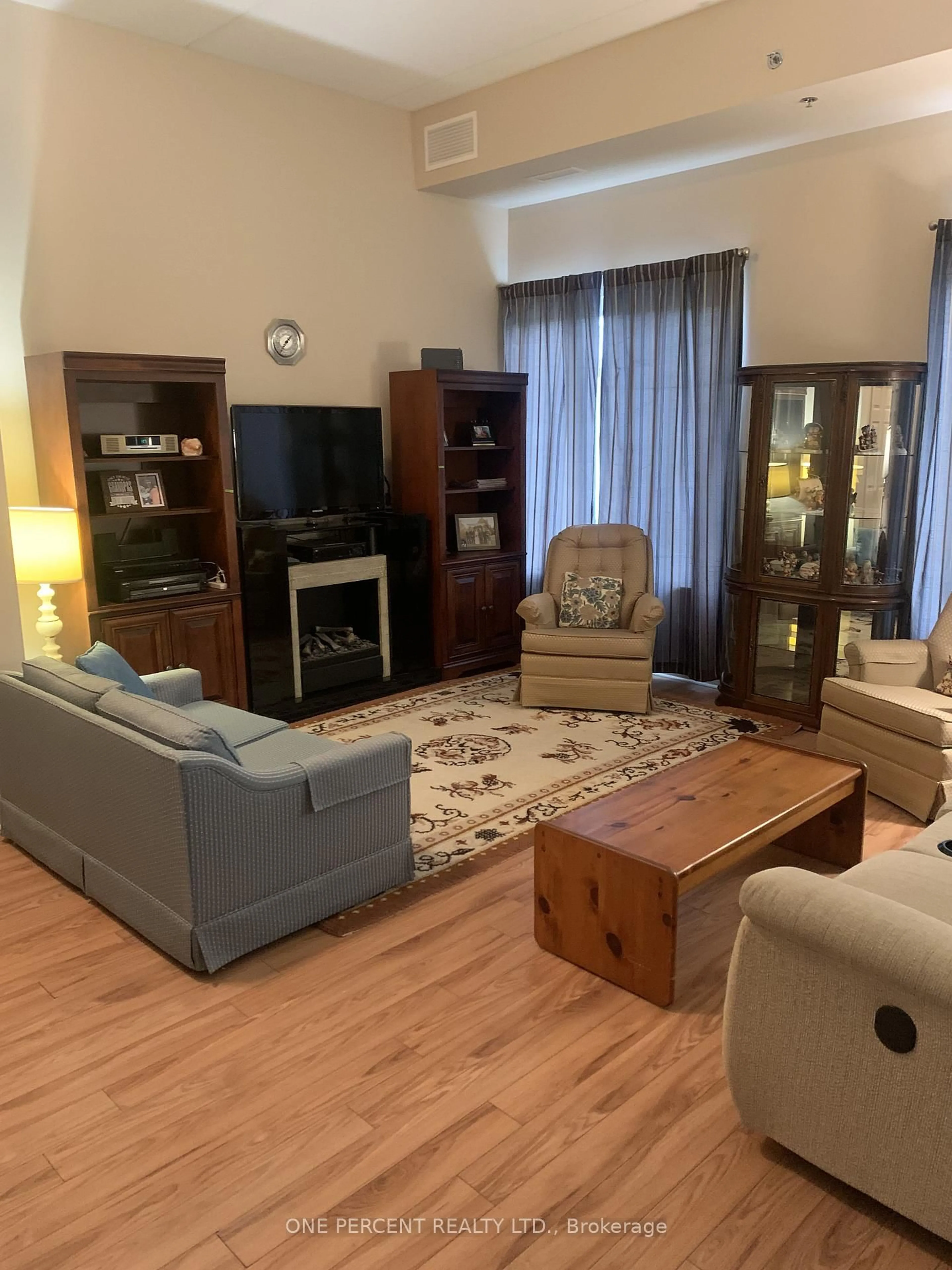 Living room with furniture, wood/laminate floor for 200 MCCARTHY Rd #164, Stratford Ontario N5A 0B6