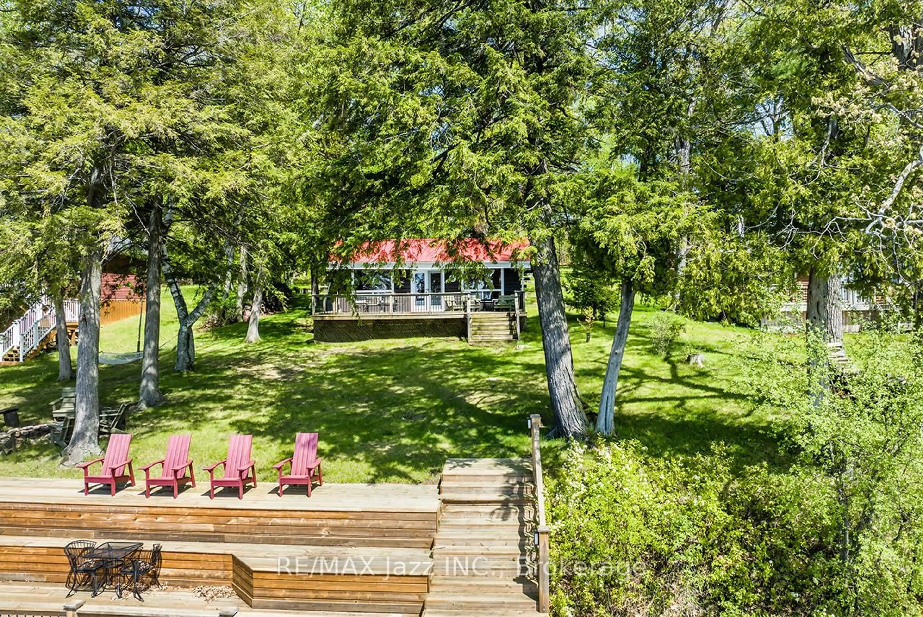 A pic from outside/outdoor area/front of a property/back of a property/a pic from drone, forest/trees view for 31 Long Island, Otonabee-South Monaghan Ontario K0K 2E0