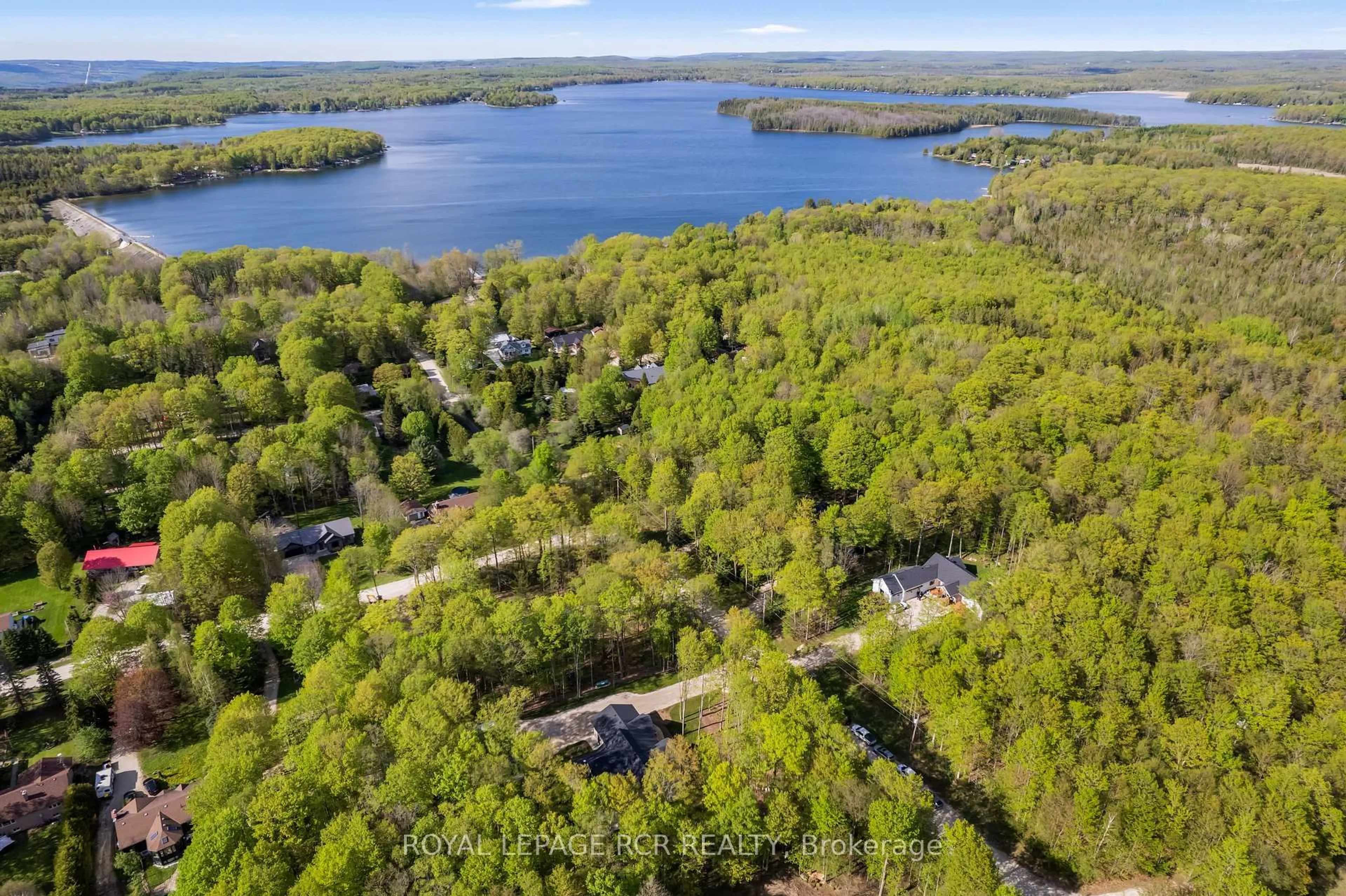 A pic from outside/outdoor area/front of a property/back of a property/a pic from drone, water/lake/river/ocean view for 110 Beau Lane, Grey Highlands Ontario N0C 1E0