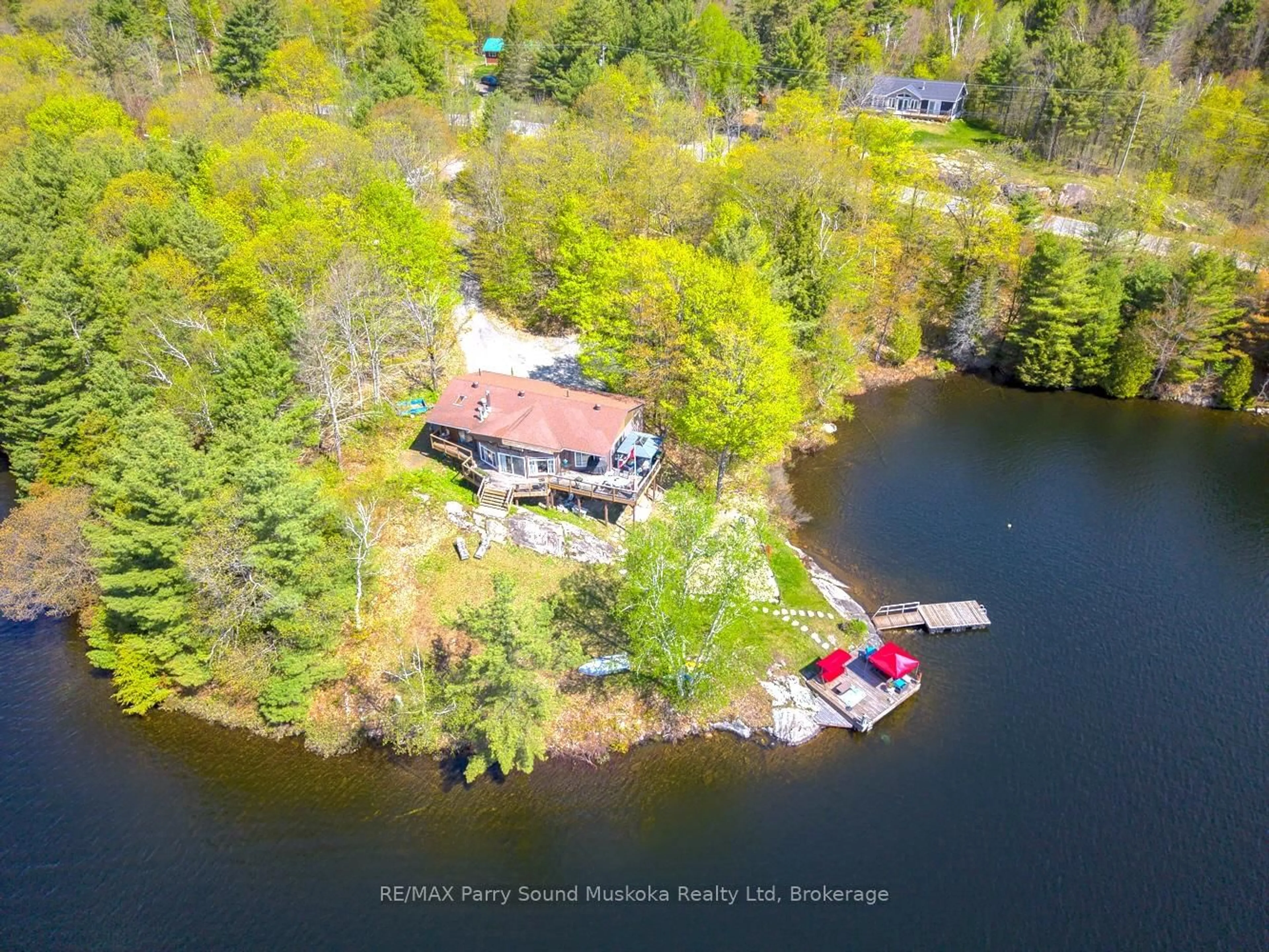 A pic from outside/outdoor area/front of a property/back of a property/a pic from drone, water/lake/river/ocean view for 207 Rankin Lk Rd, Seguin Ontario P2A 0B2
