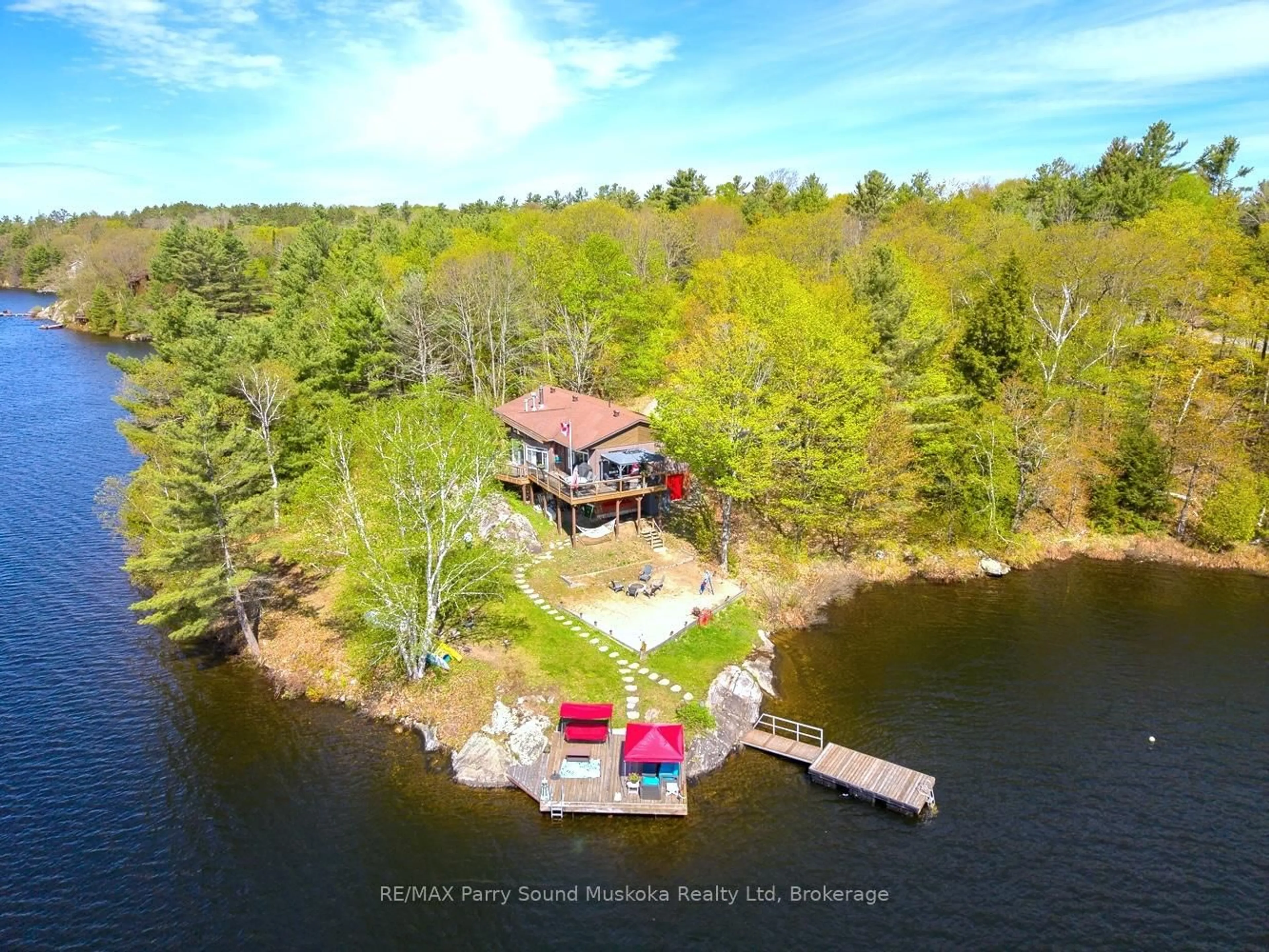 A pic from outside/outdoor area/front of a property/back of a property/a pic from drone, water/lake/river/ocean view for 207 Rankin Lk Rd, Seguin Ontario P2A 0B2