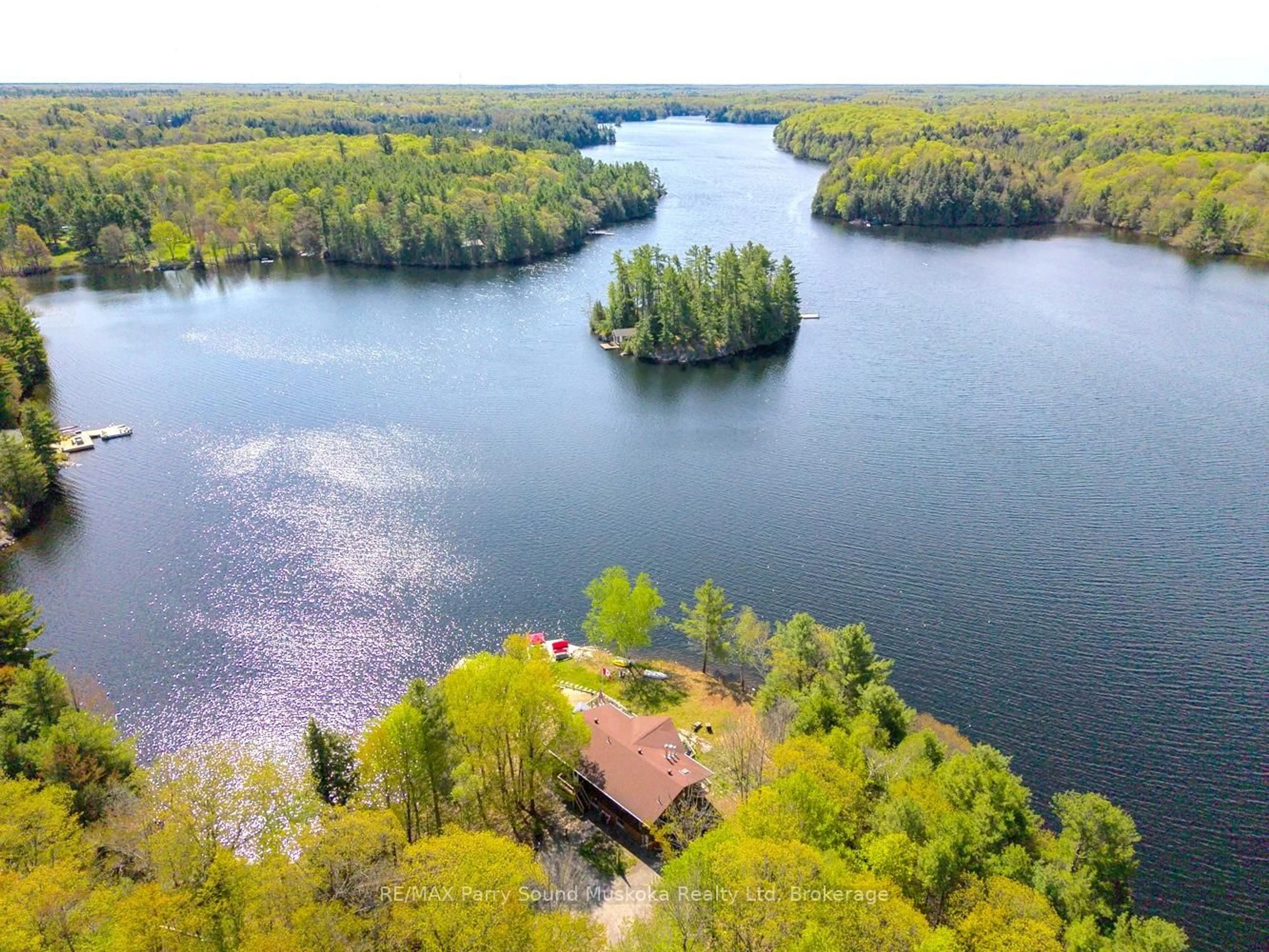 A pic from outside/outdoor area/front of a property/back of a property/a pic from drone, water/lake/river/ocean view for 207 Rankin Lk Rd, Seguin Ontario P2A 0B2