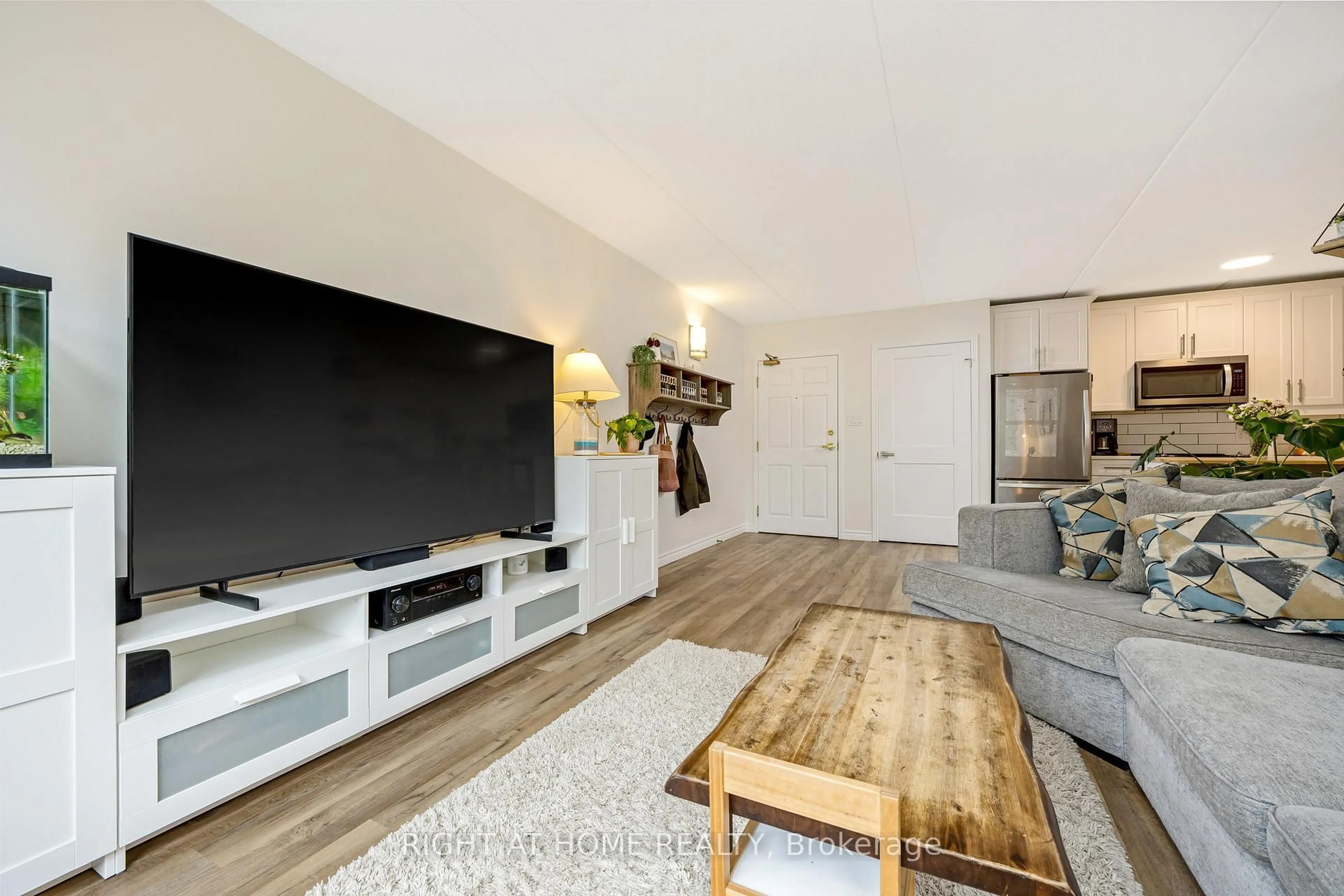 Living room with furniture, wood/laminate floor for 264 Alma St #203, Guelph/Eramosa Ontario N0B 2K0