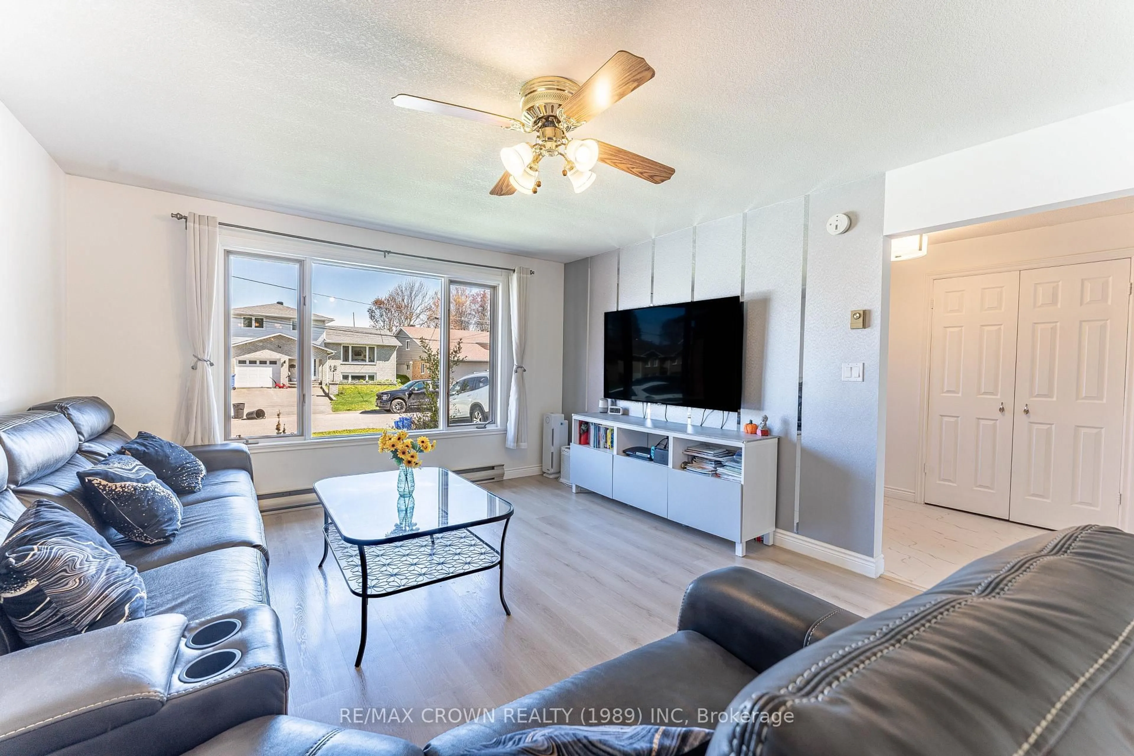 Living room with furniture, wood/laminate floor for 53 Sable Cres, North Bay Ontario P1A 3X6