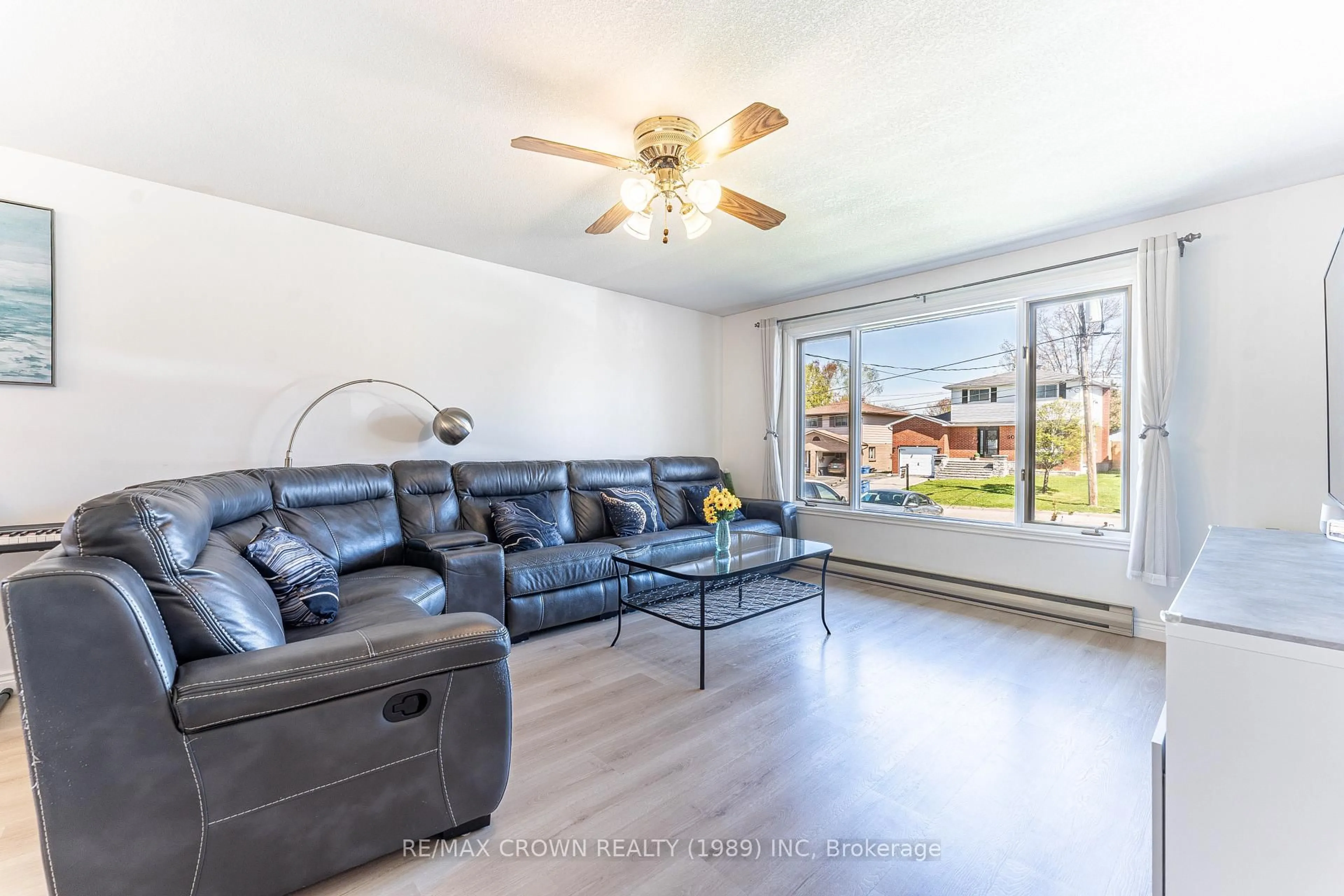Living room with furniture, wood/laminate floor for 53 Sable Cres, North Bay Ontario P1A 3X6